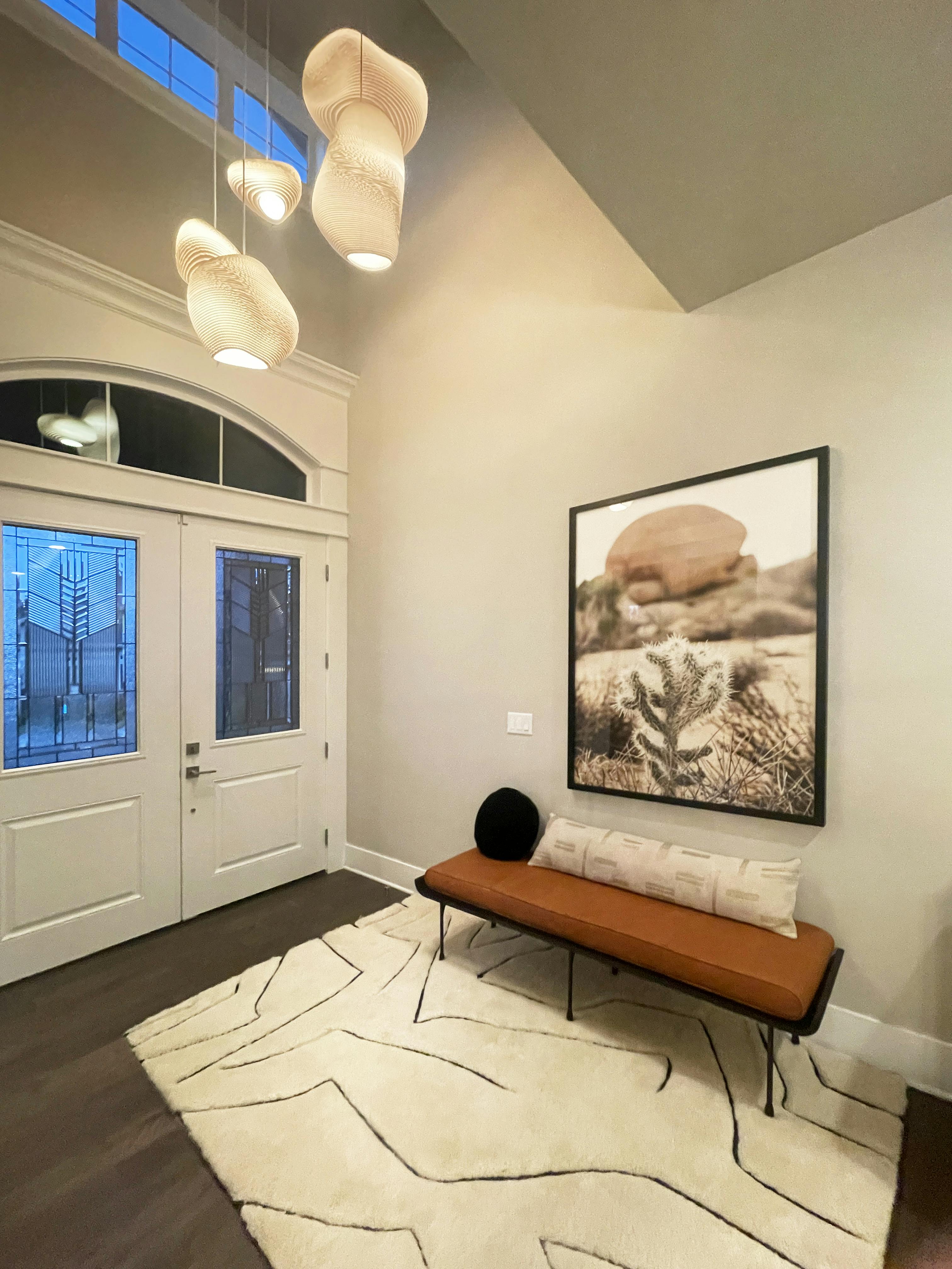 Entryway Design by Persimmon Design featuring custom chandelier made from recycled cardboard