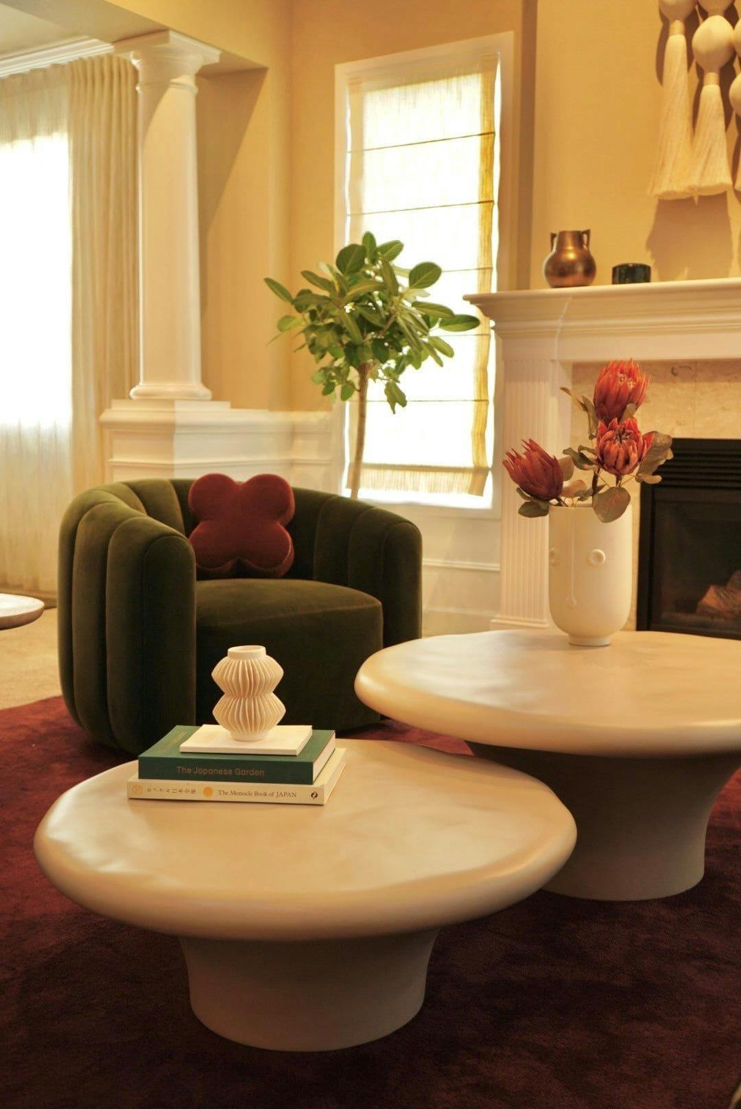 Curvy swivel chairs are like a warm hug in this living room designed by Persimmon Design