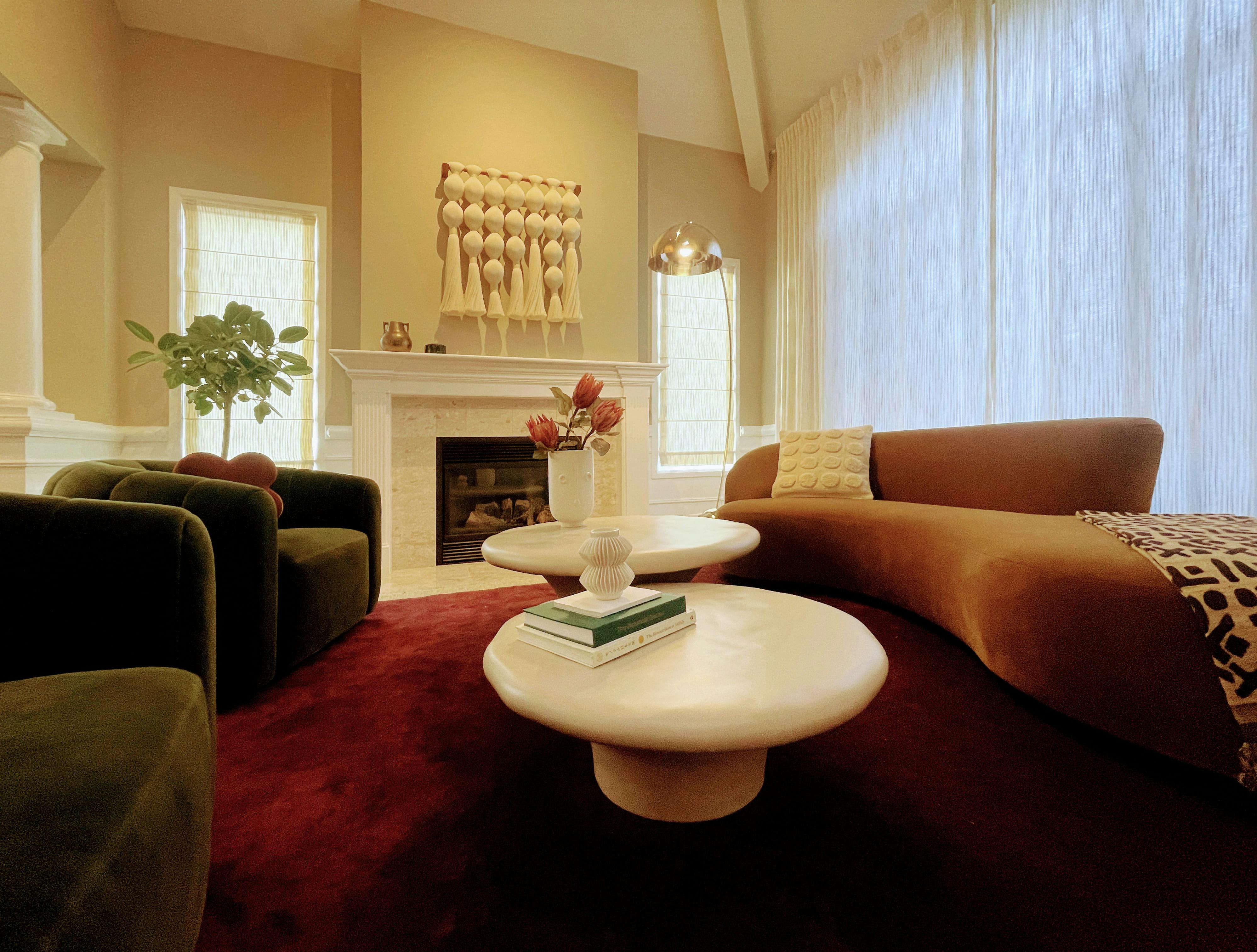 This resplendent Living Room designed by Persimmon Design pairs bold burgundy and ochre with green