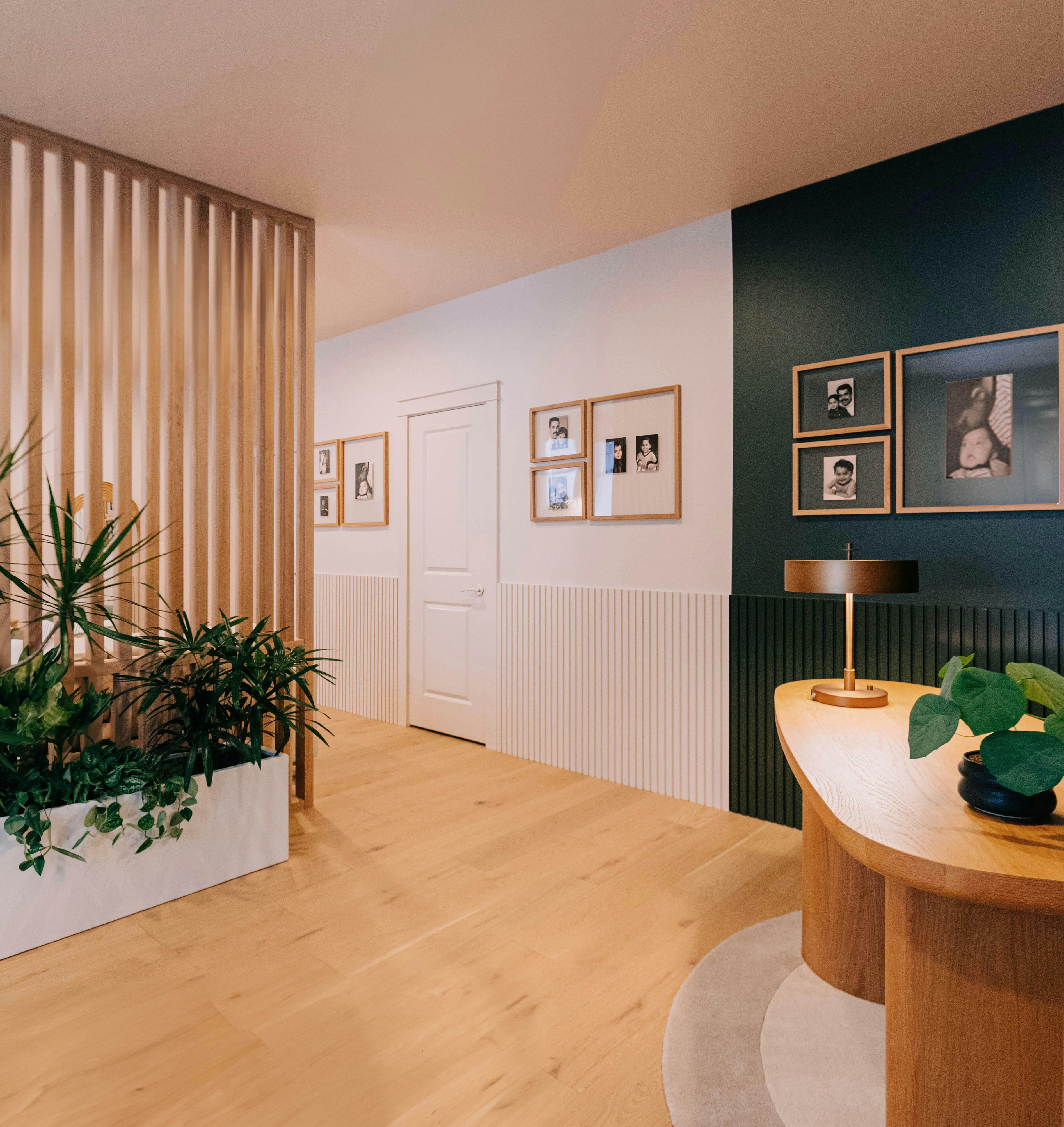 This multipurpose room designed by Persimmon Design uses color to emphasize the different spaces in the room