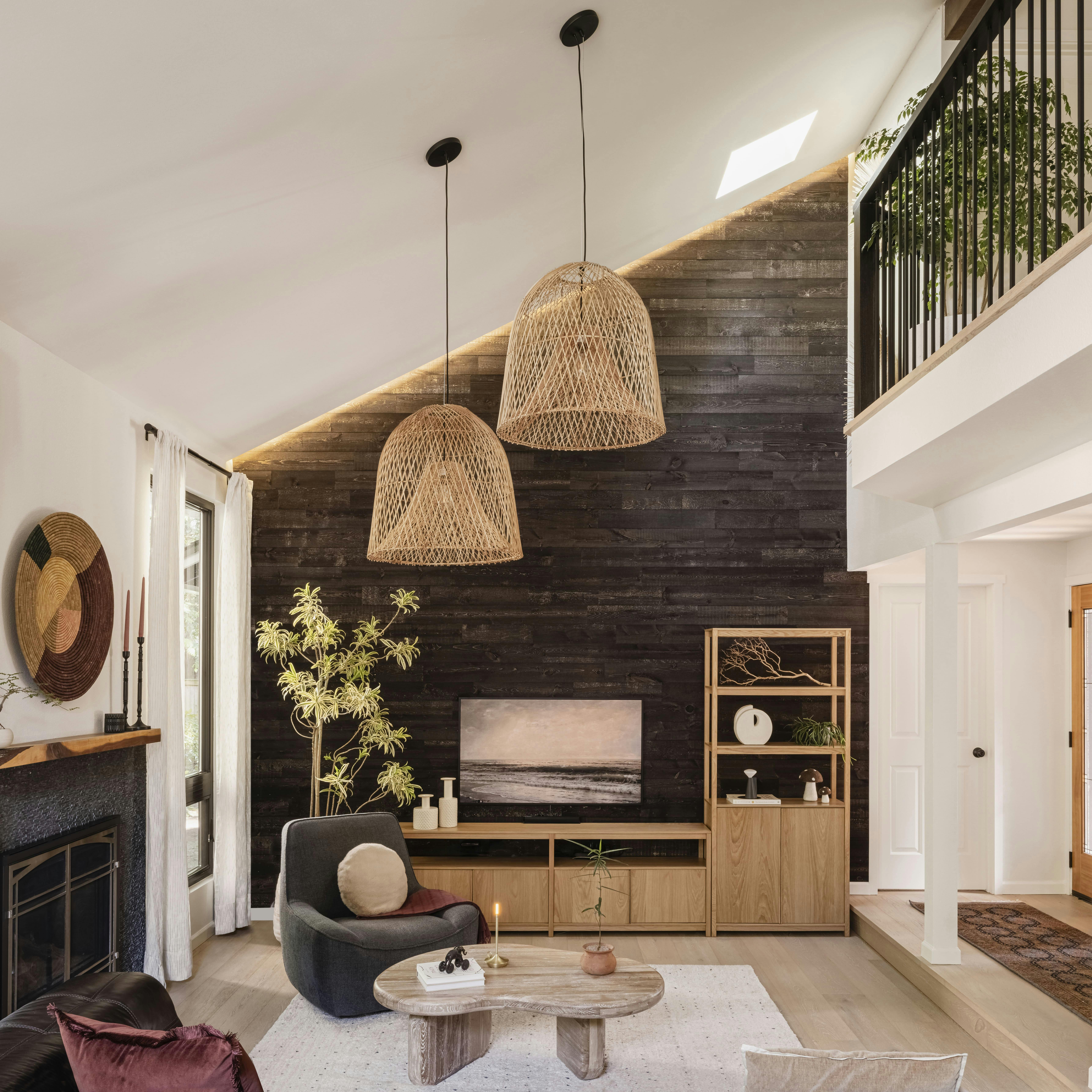 Layered in earthen tones and natural textures, this Persimmon Design living room invites comfort through warmth, intimacy, and the quiet rhythm of everyday gathering.