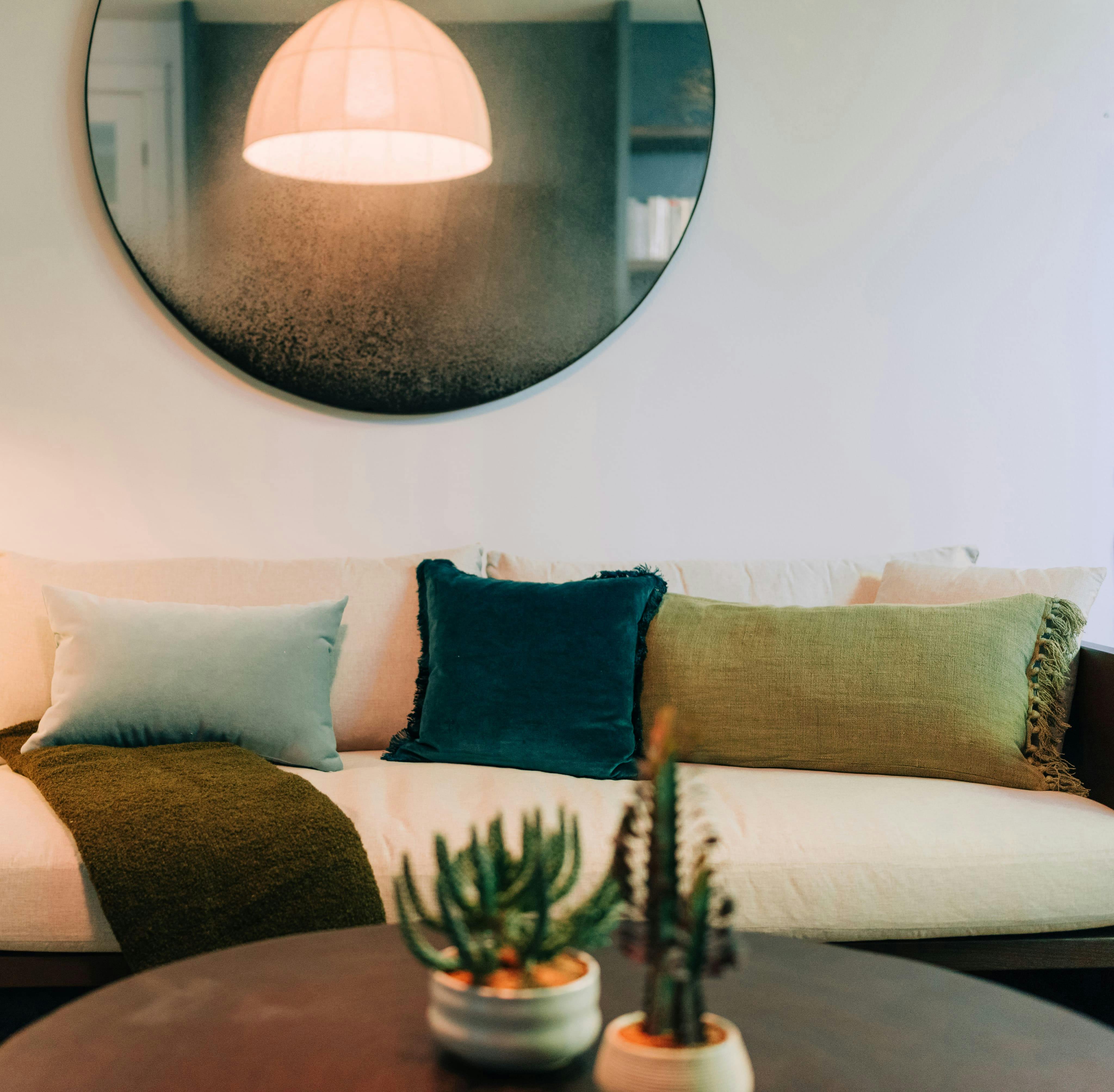 In this Wellness Room designed by Persimmon Design - Seattle Interior Designer, the antique mirror’s patina softens each reflection, layering the room with a sense of history and quiet mystery. Photography by Alexis Grosclaude Photography.