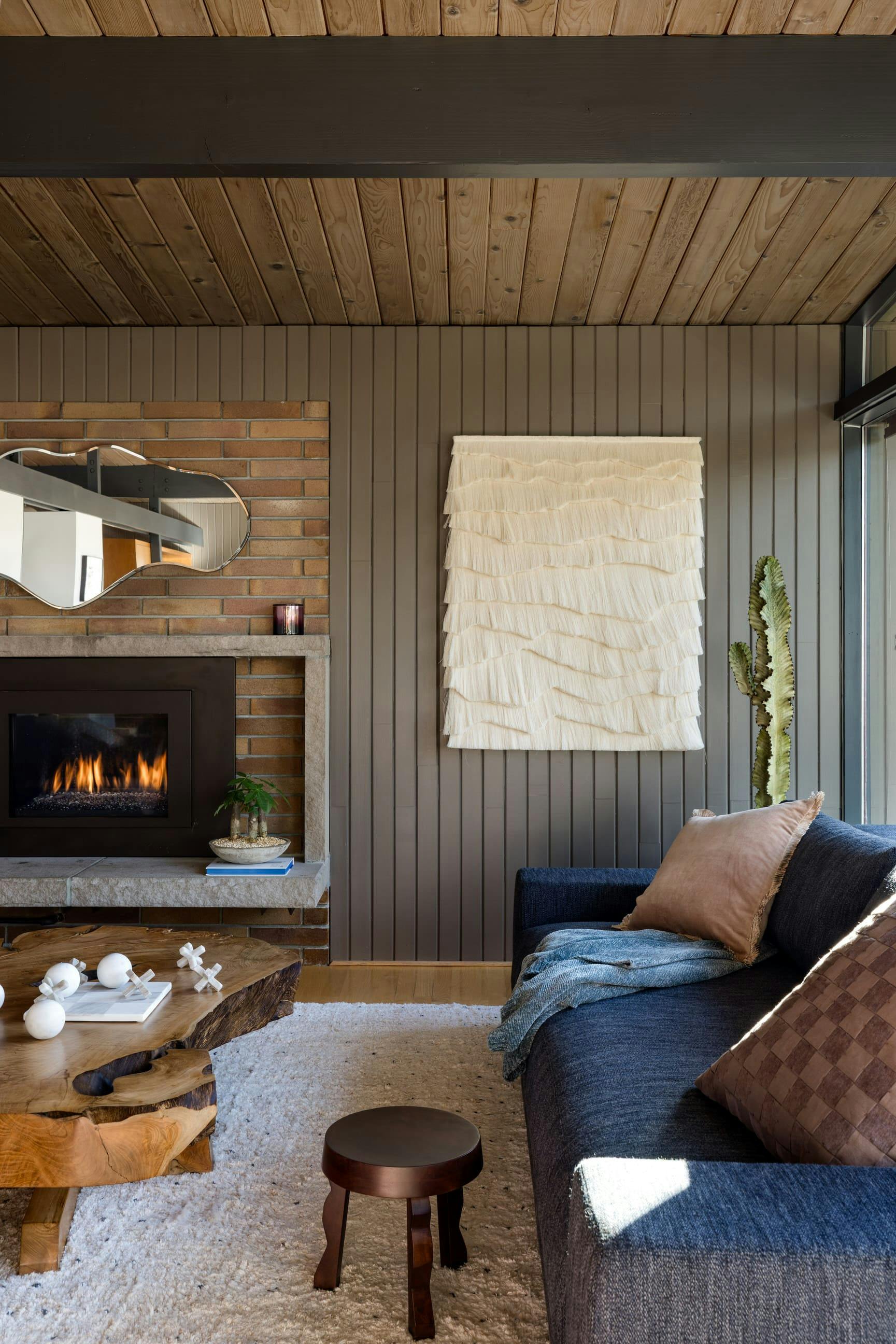 The softness of textiles, greenery, and organic forms create a sense of ease in this family room by Persimmon Design Photo courtesy: Miranda Estes Photography