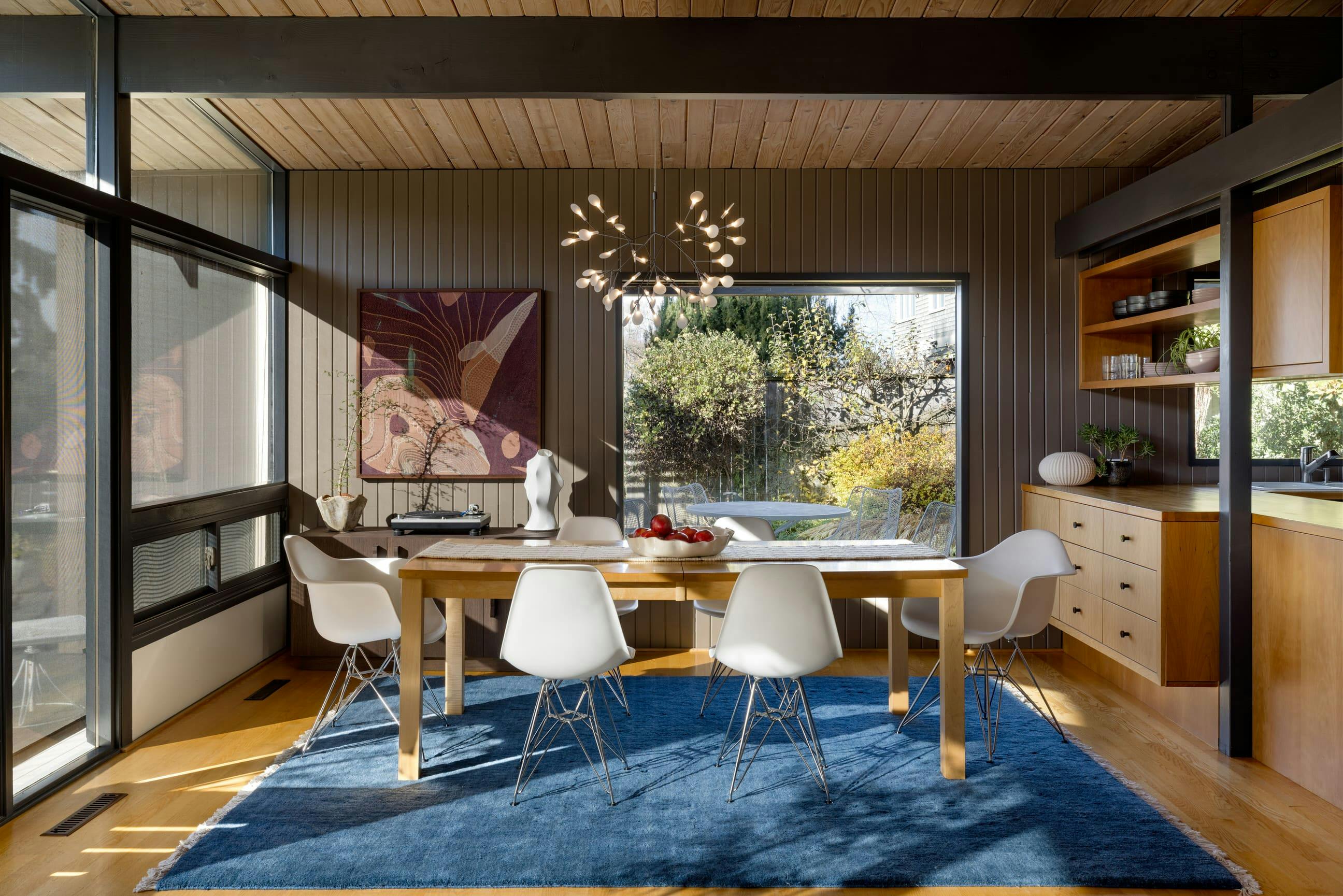 In this dining room by Persimmon Design, an intuitive understanding of light, rhythm, and proportion allows the dining room to feel both composed and completely at ease.  Photo courtesy: Miranda Estes Photography