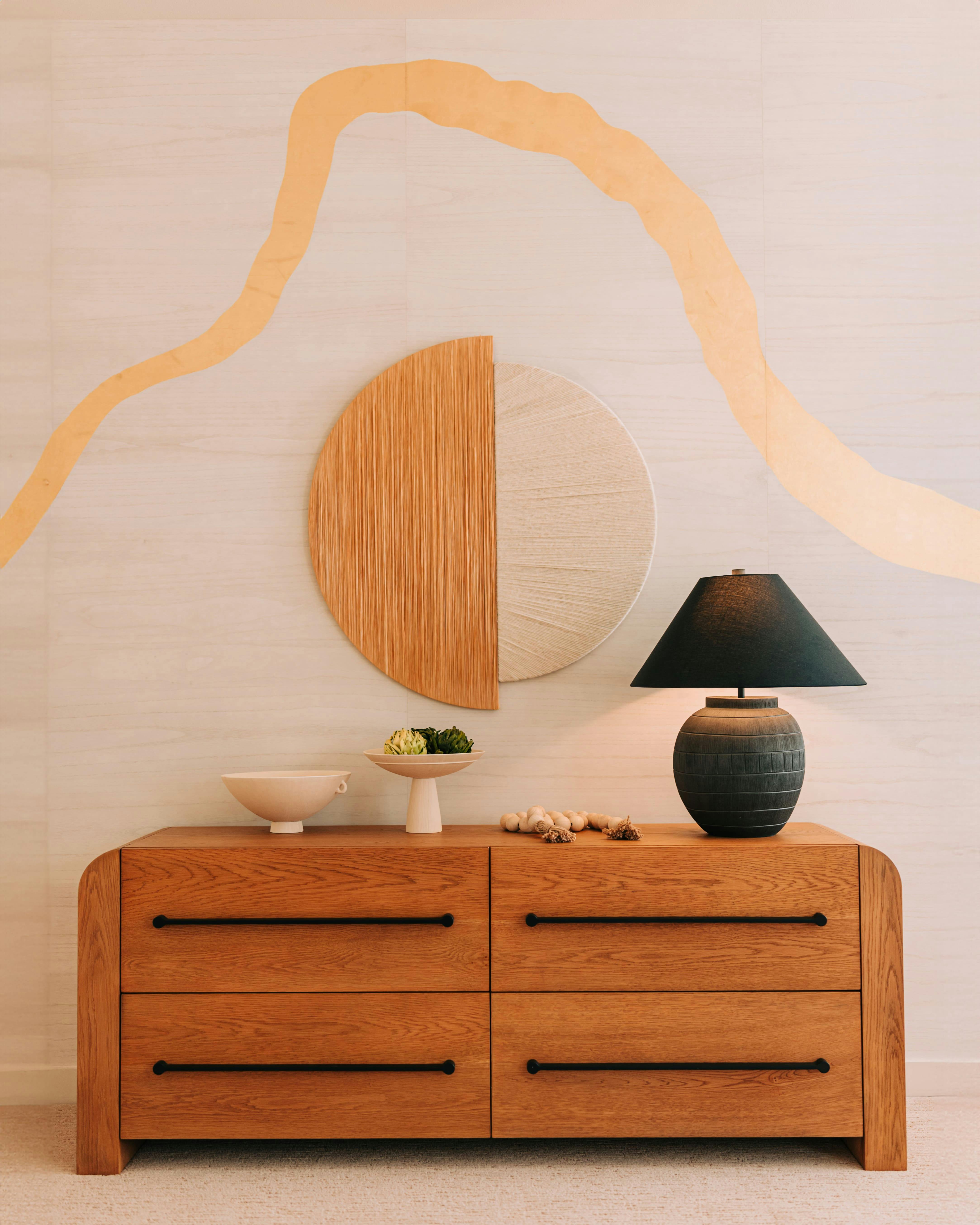 A wallcovering inspired by the Japanese art of kintsugi washes across the master bedroom, its luminous seams transforming a once-quiet wall into a moment of intention, reverence, and quiet mastery.