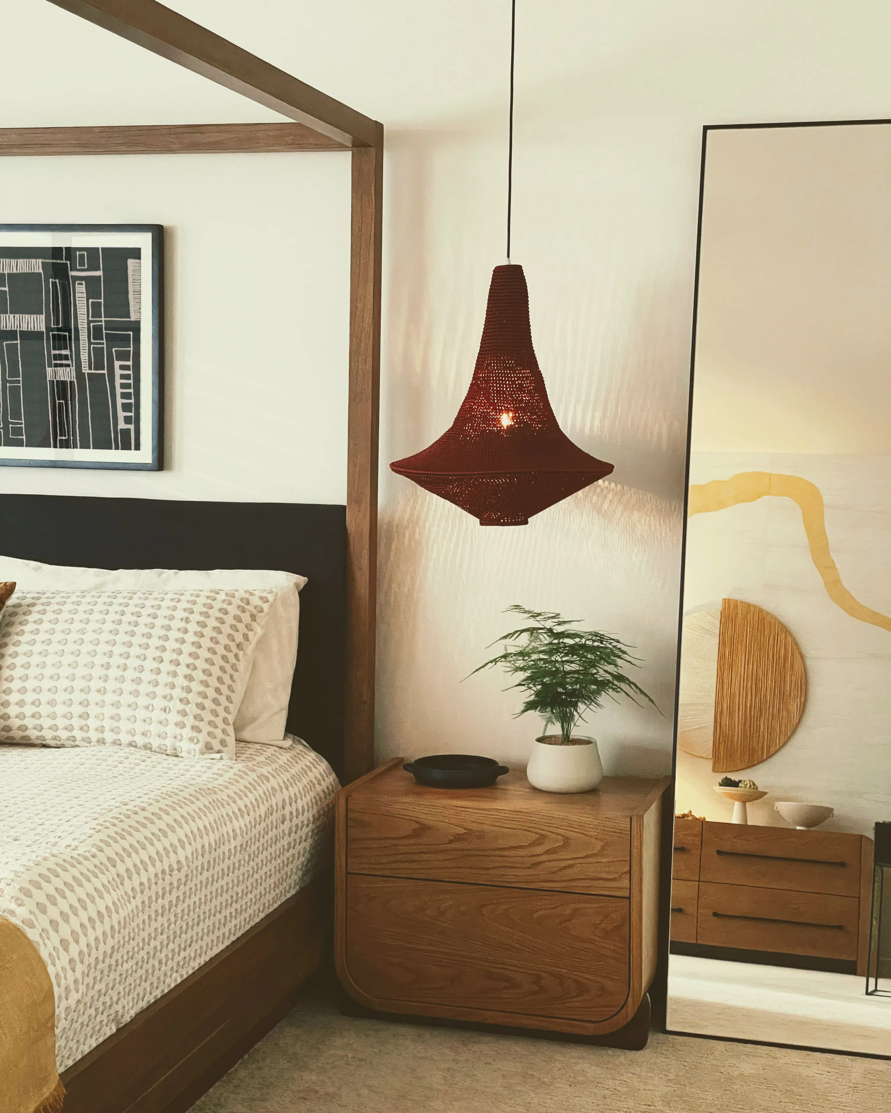 In this bedroom by Persimmon Design, a handcrafted bedside pendant casts a soft glow that restores depth and warmth to wood, textiles, and artwork — a simple lighting intervention that counters the flattening effect of Seattle’s cool winter daylight.