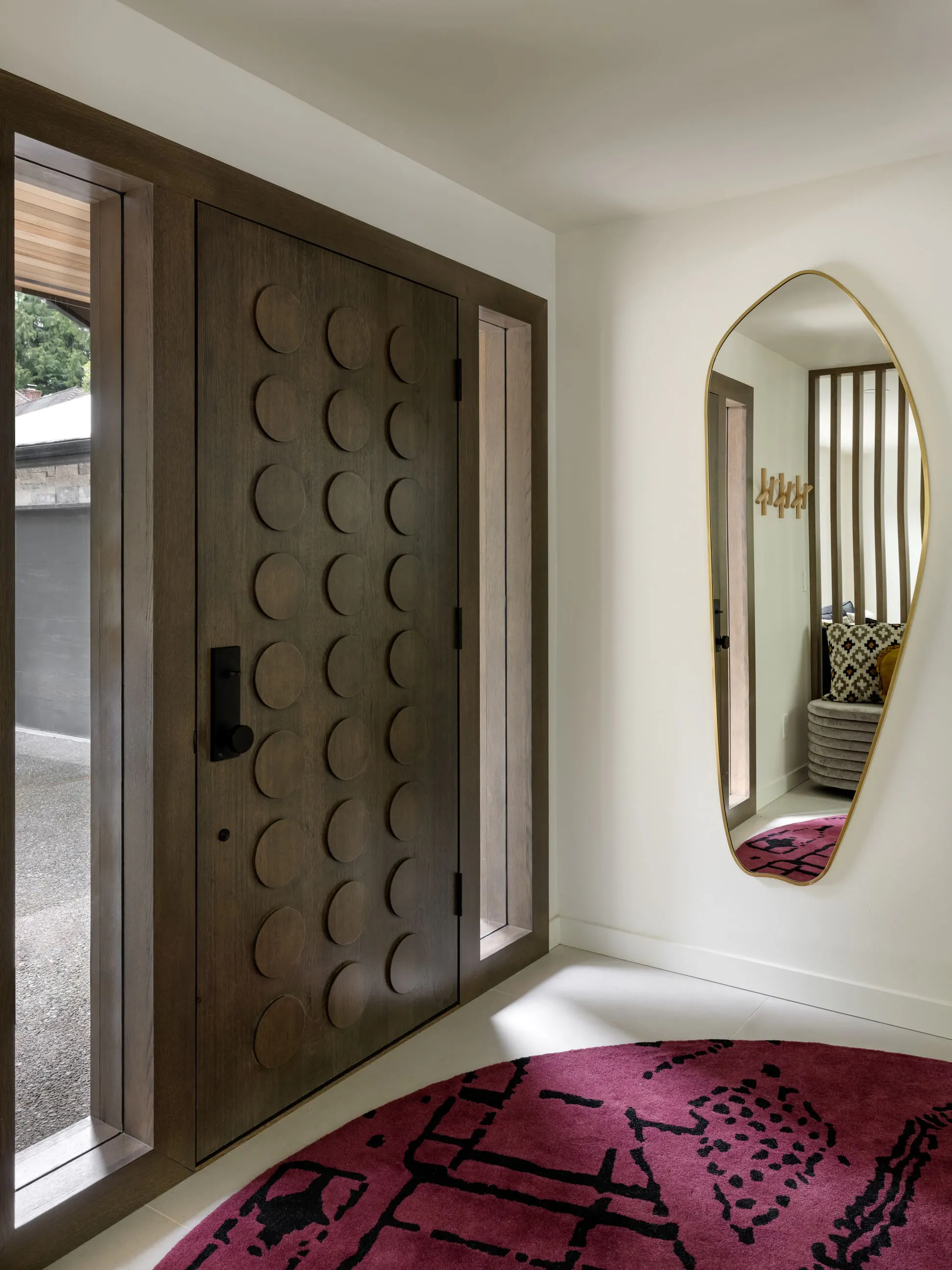 The most enduring spaces are not the loudest, but the most intriguing—this custom entry door designed by Persimmon Design continues to reveal itself over time.