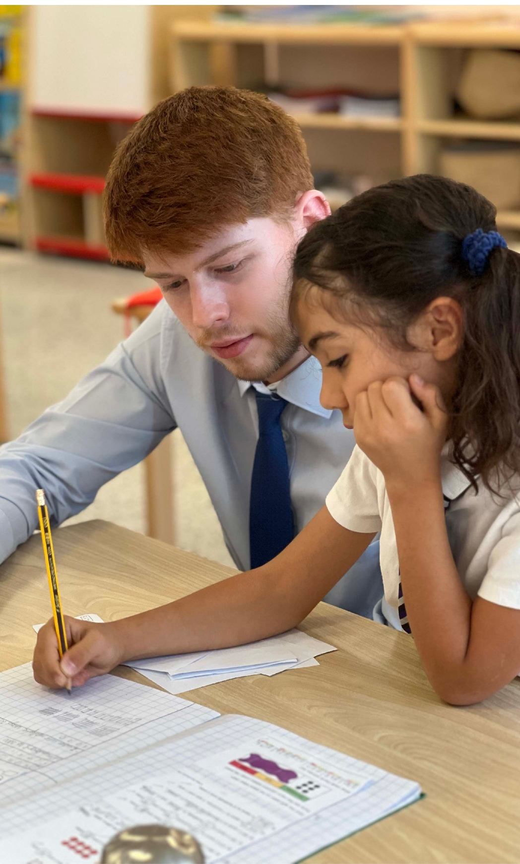 uppingham school teacher working with a pupil