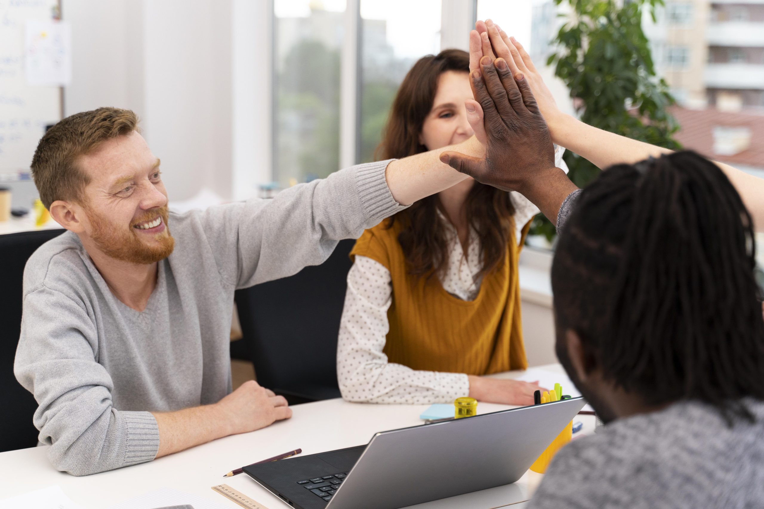Group of workers high five