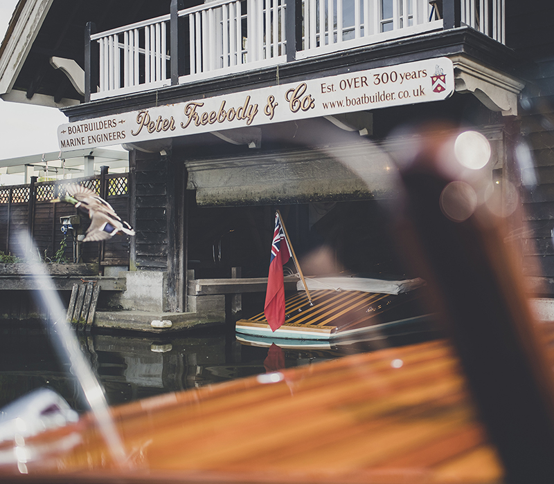 Luxury boatbuilders, Freebody Slipper launch moored beneath boathouse 