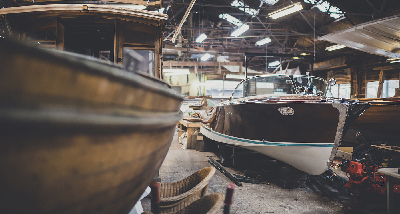 Riva boats for sale, starboard side view of Riva Ariston in workshop at Peter Freebody & Co 