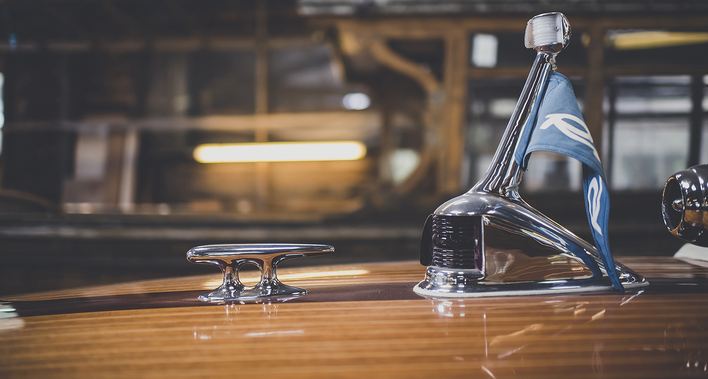 Riva pennant on forward deck of Riva in workshop at Peter Freebody & Co