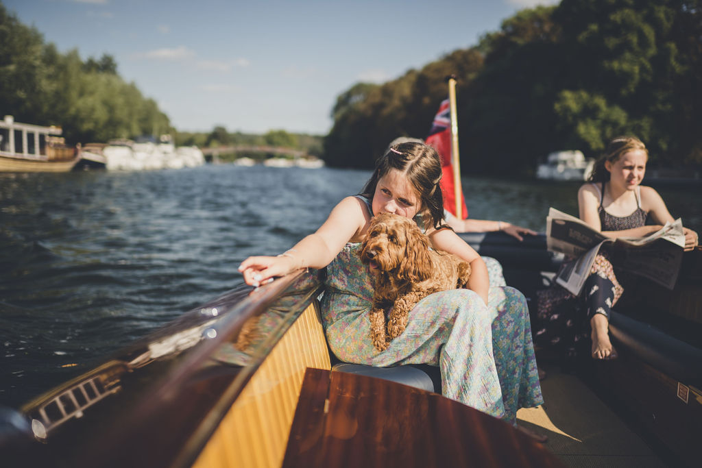 Classic boats for sale, child and dog onboard Freebody slipper launch on river Thames