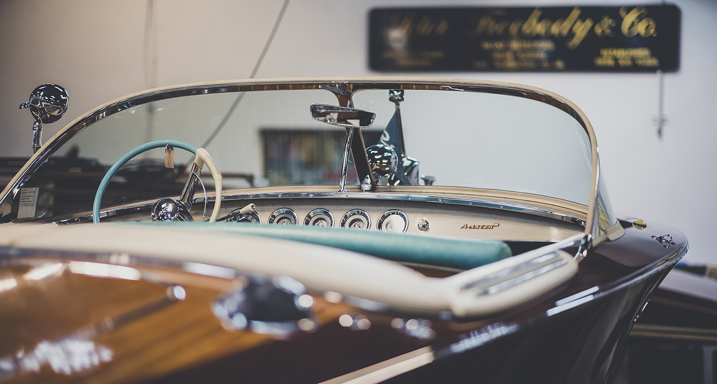 Riva boats for sale, view of helm and dash on Riva with Peter Freebody & Co signage in background