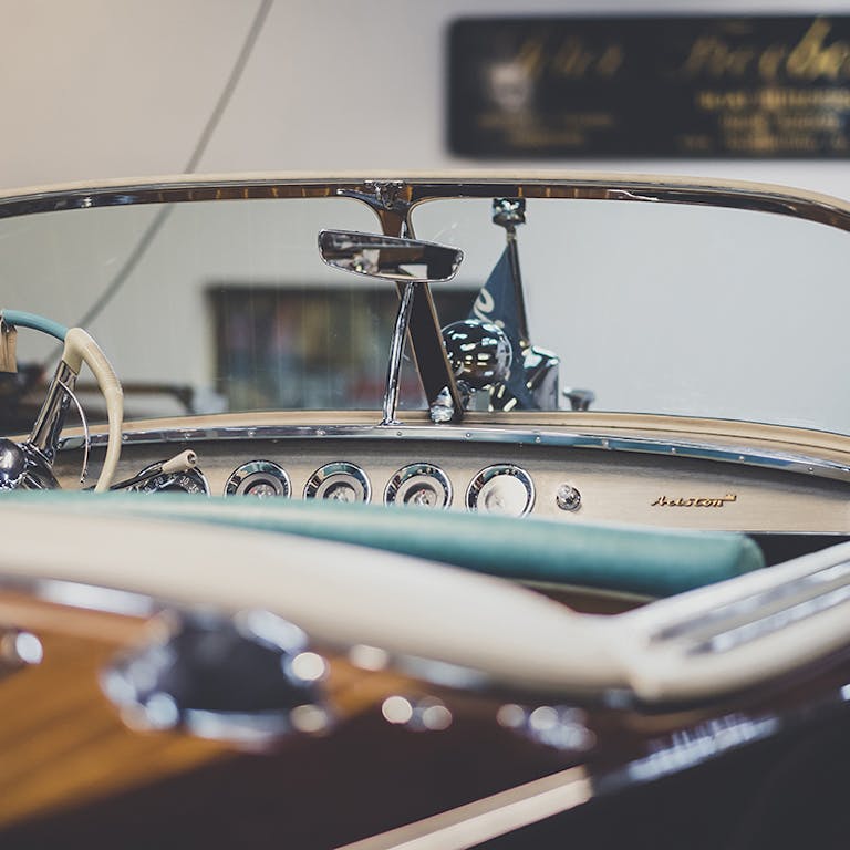 Riva boats for sale, view of helm and dash on Riva with Peter Freebody & Co signage in background