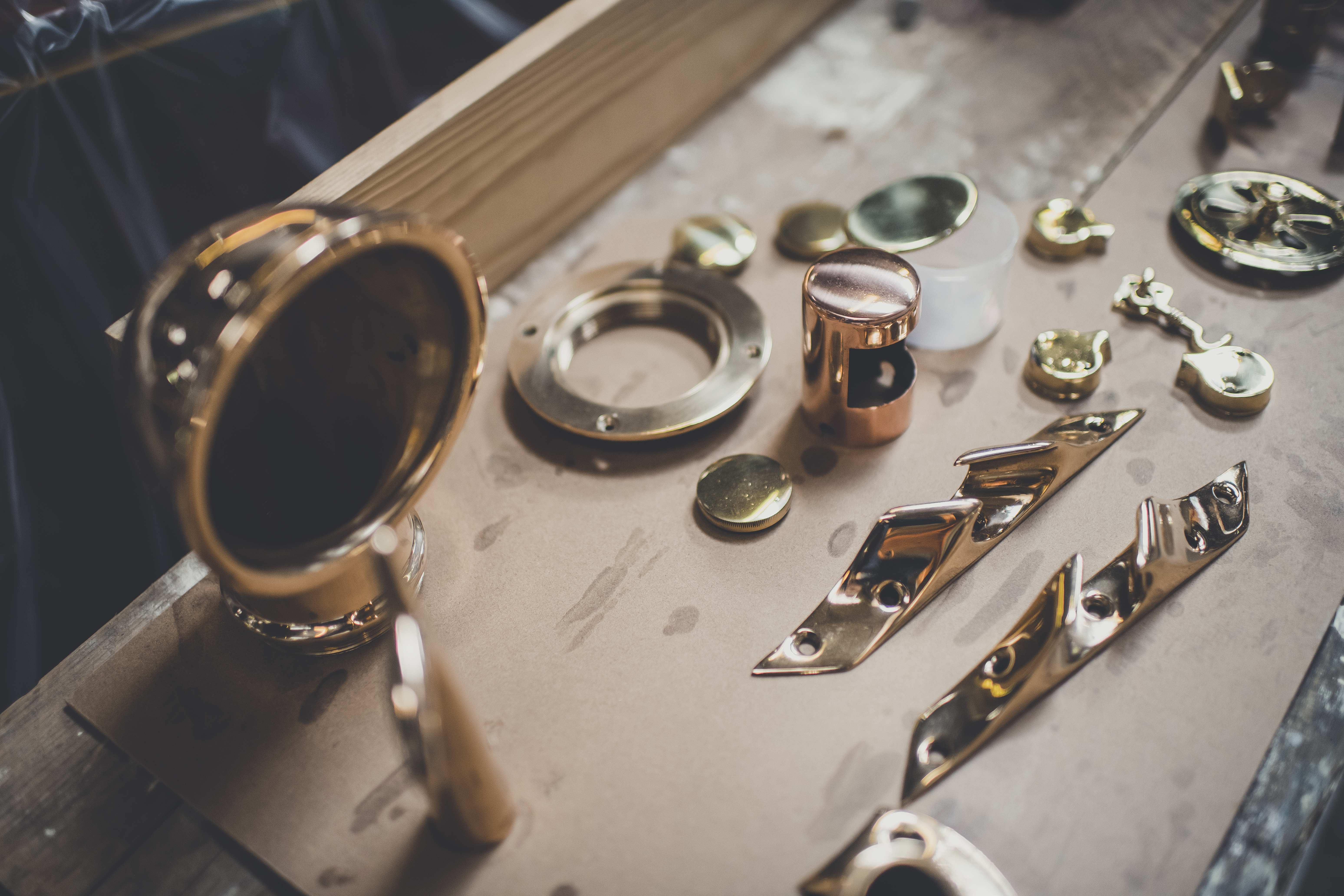 Wooden boat restoration, detail photo showing boat fittings in Freebody workshop ready for re chroming