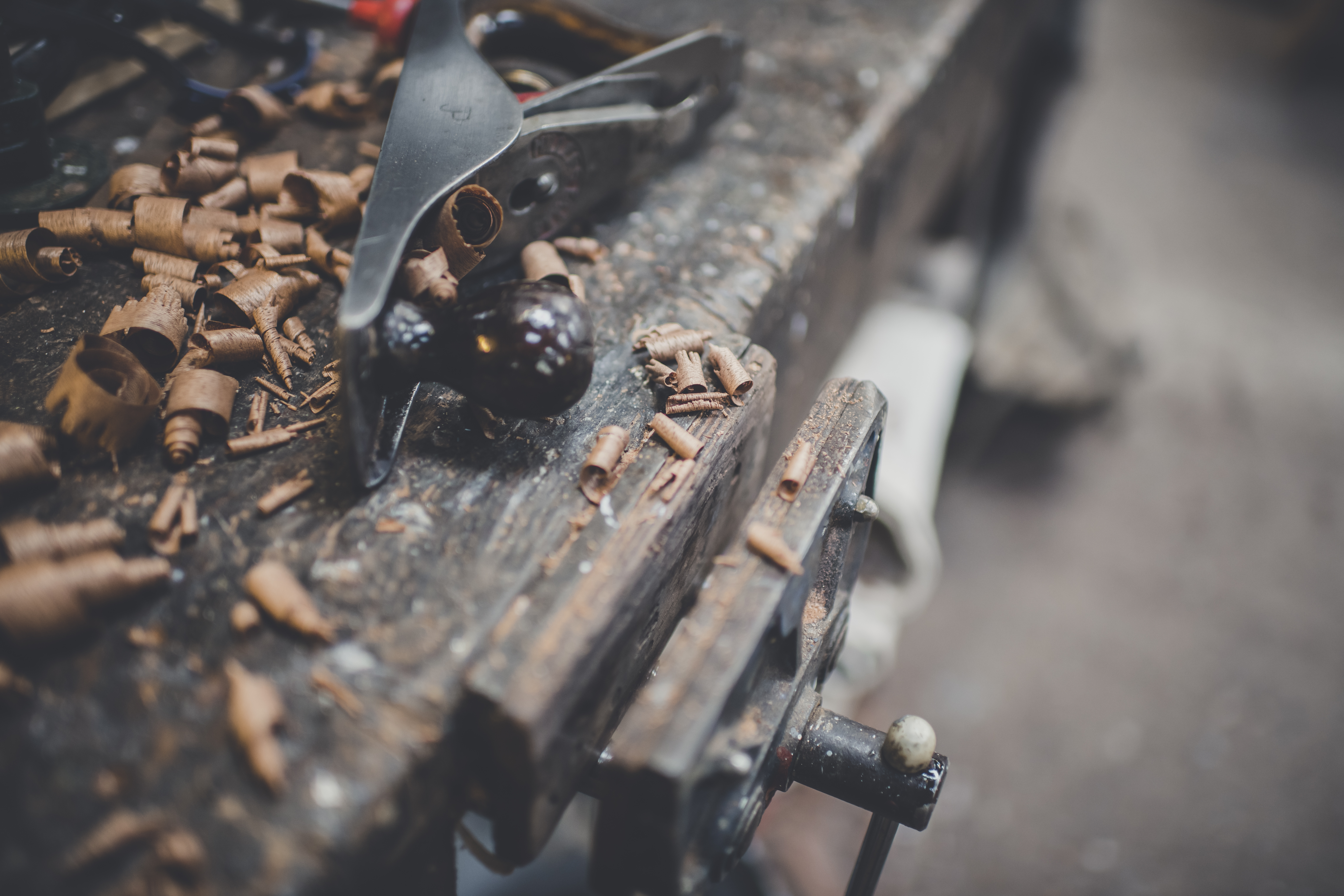 boatbuilder's plane with wood shavings on bench in Peter Freebody & Co workshop