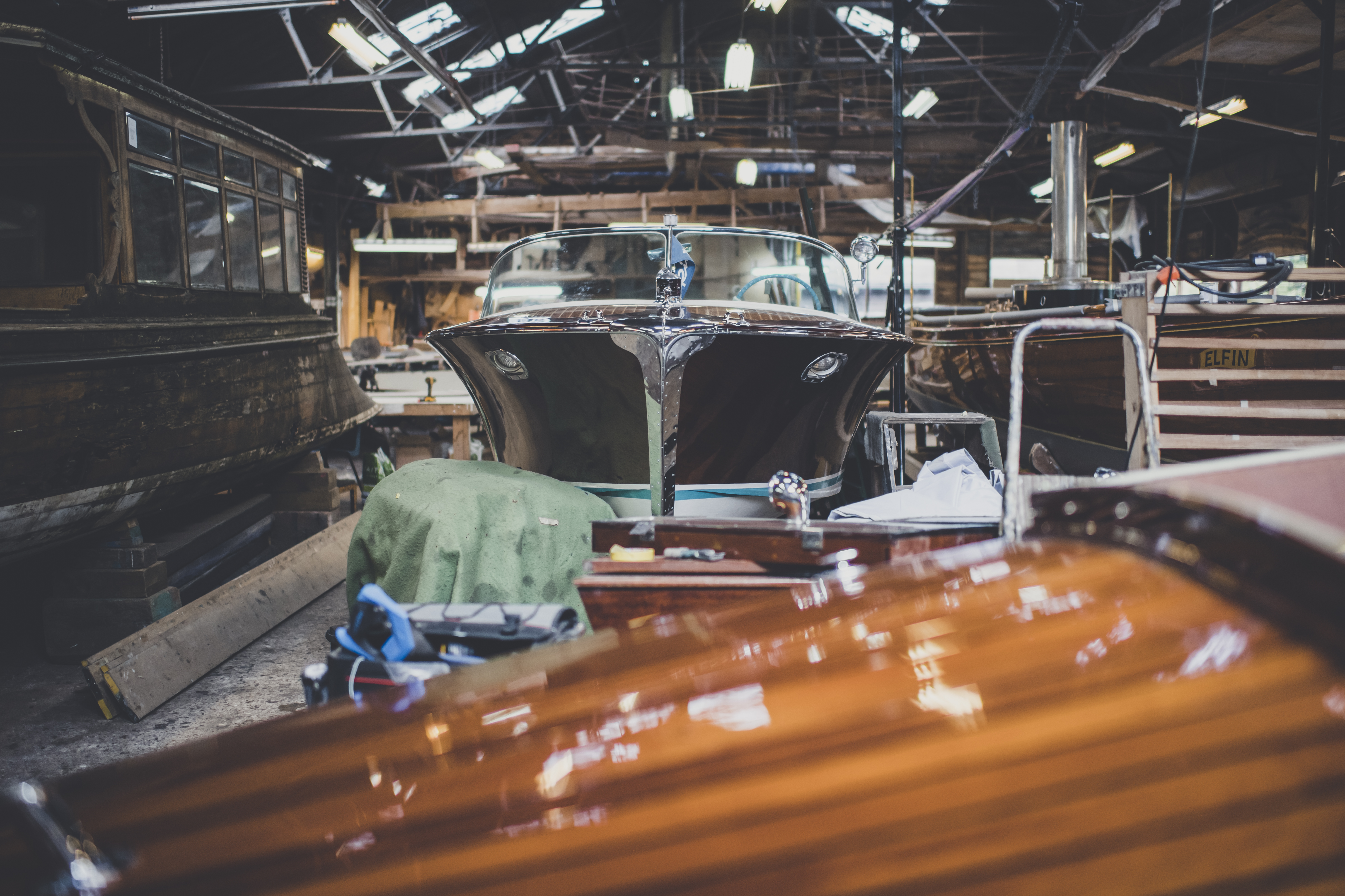 Riva boats for sale, front view of the bow of a Riva Ariston in the workshop of Peter Freebody & Co
