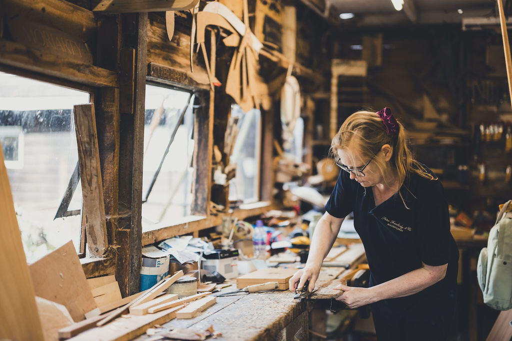 Wooden boat restoration, restoring boat parts ready for varnish in Freebody workshop