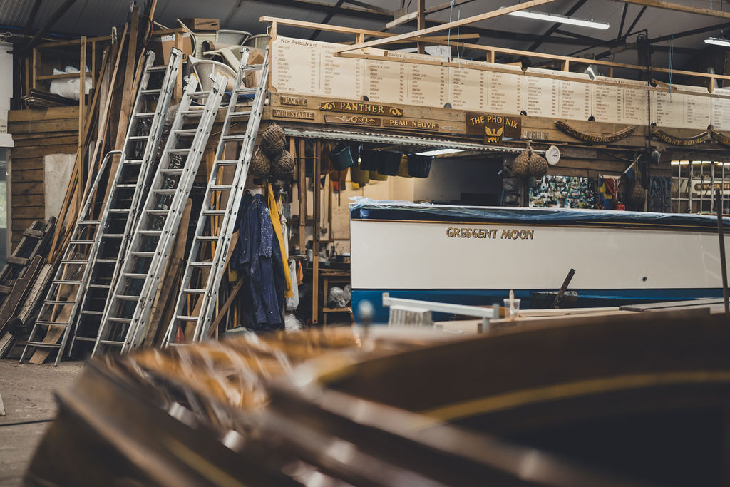 Wooden boat restoration, Freebody workshop view with restoration boards in distance