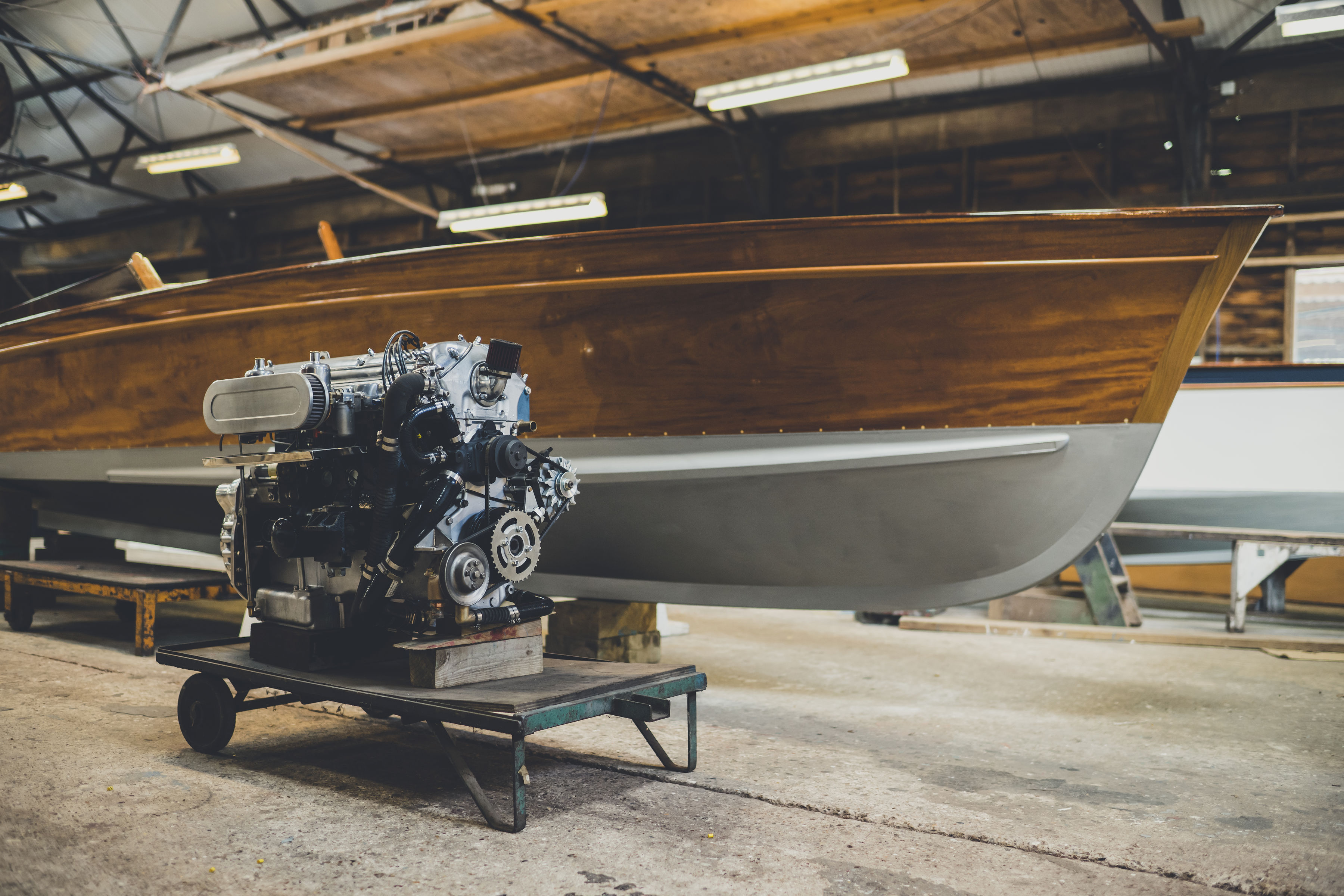 Luxury wooden boats for sale, workshop view of Freebody Spirit slipper launch with Jaguar Straight Six engine