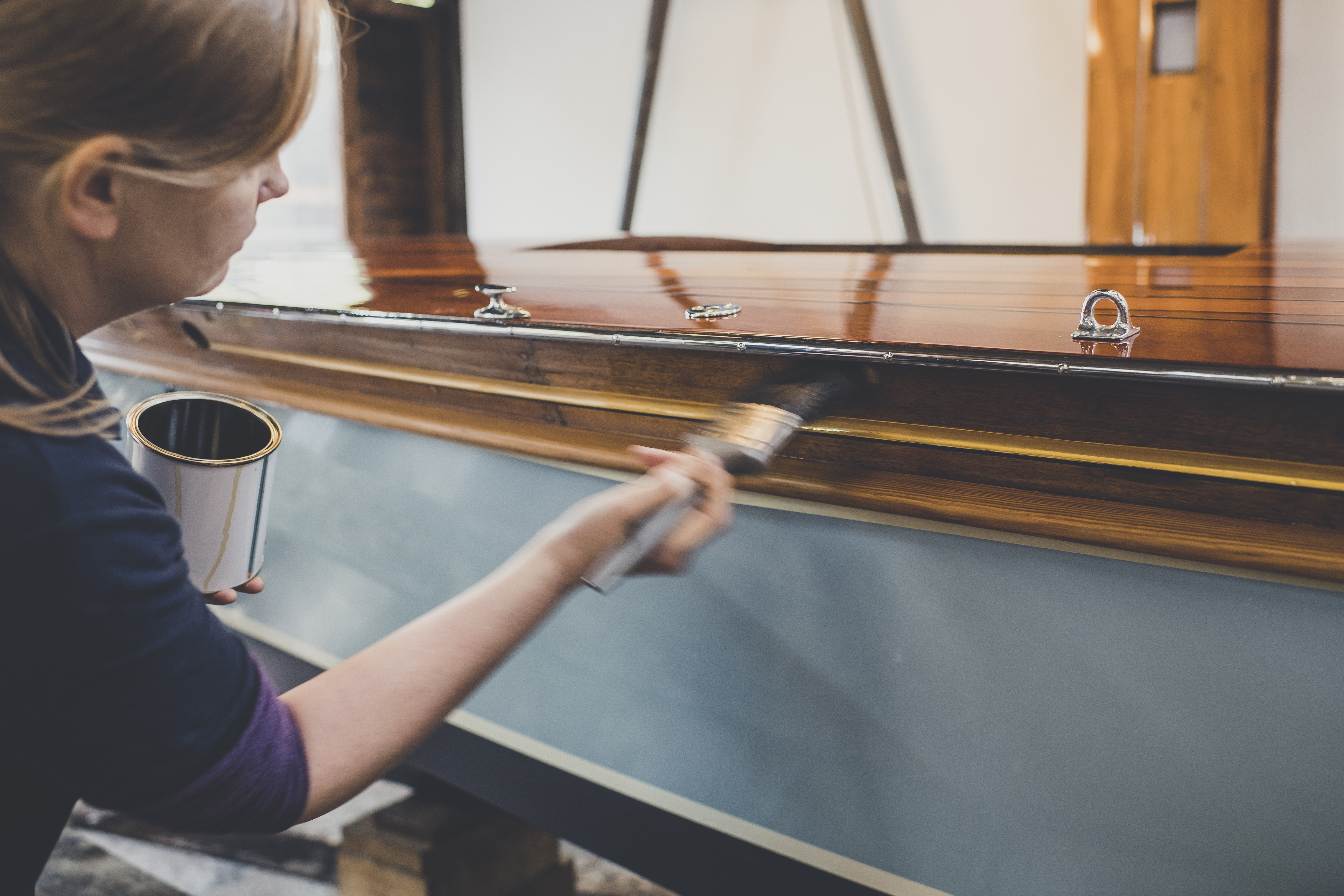 Wooden boat restoration, varnishing underway in Peter Freebody & Co workshop