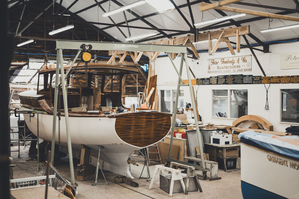 Wooden boat restoration, James Silver Silverette undergoing restoration and remodelling works in workshop of Peter Freebody & Cor Free