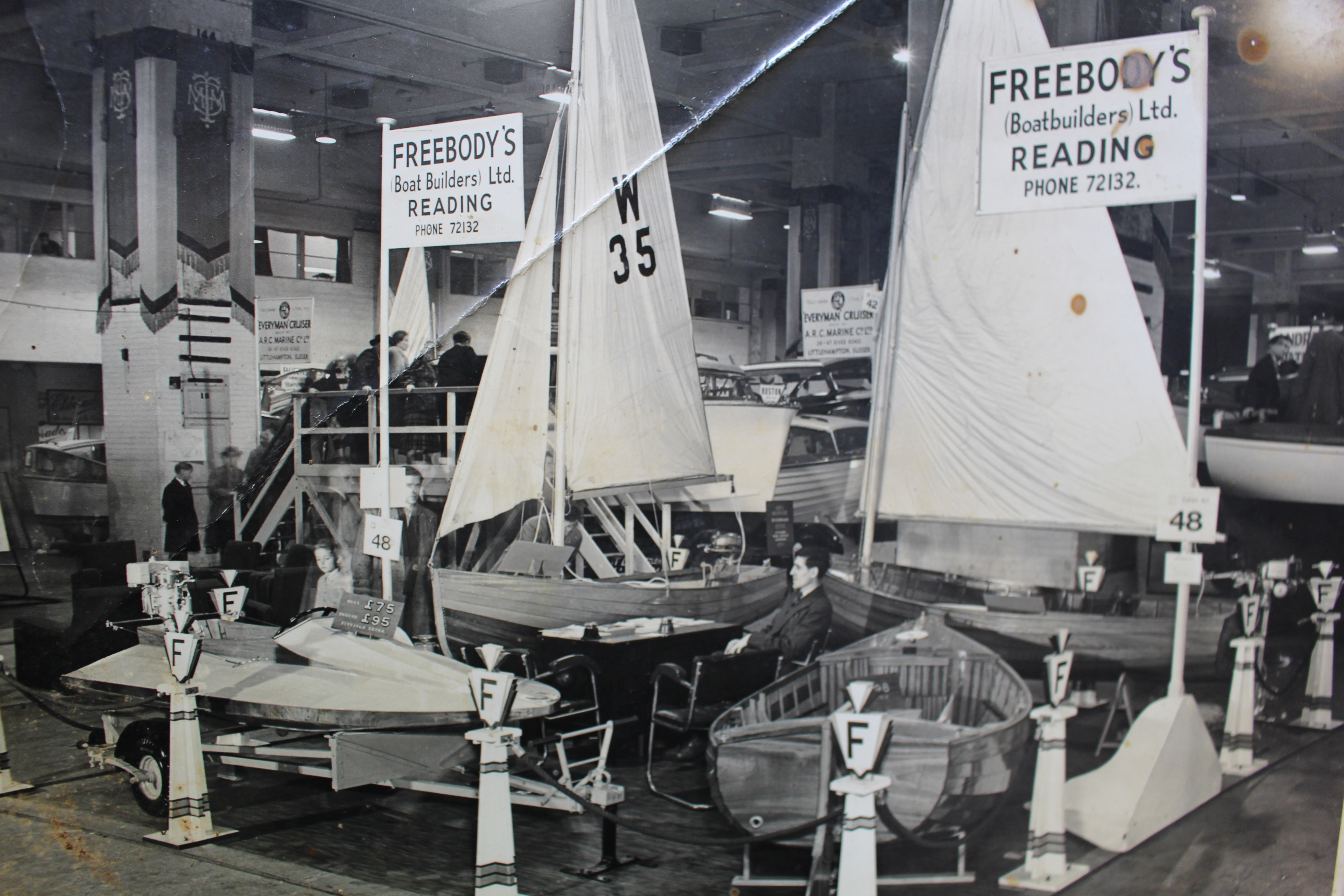 Traditional wooden boats, black & white photo of Freebody's stand at the London Boat show 1950's