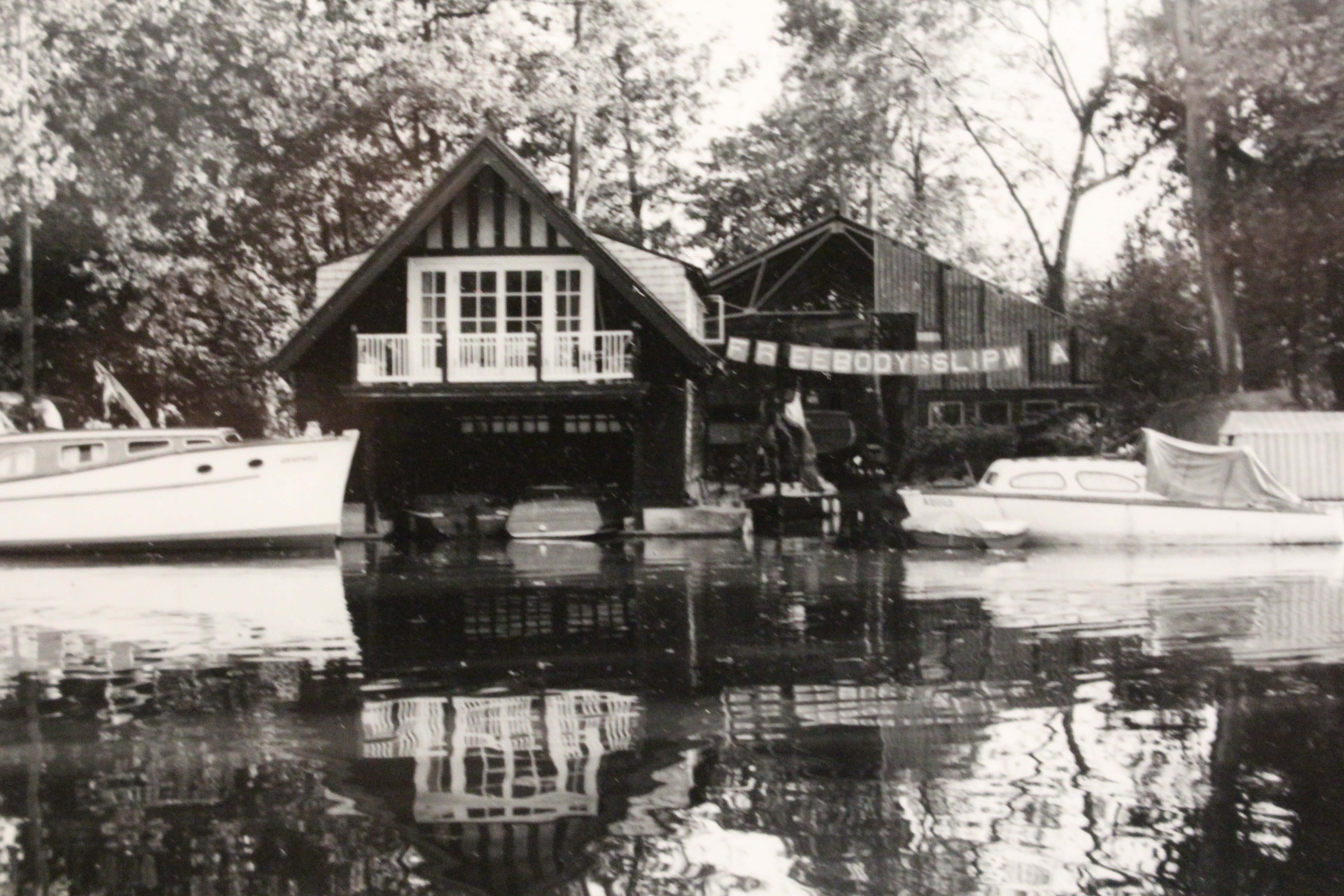 Traditional wooden boats, black & white photo of boathouse at Freebody's boatyard Hurley