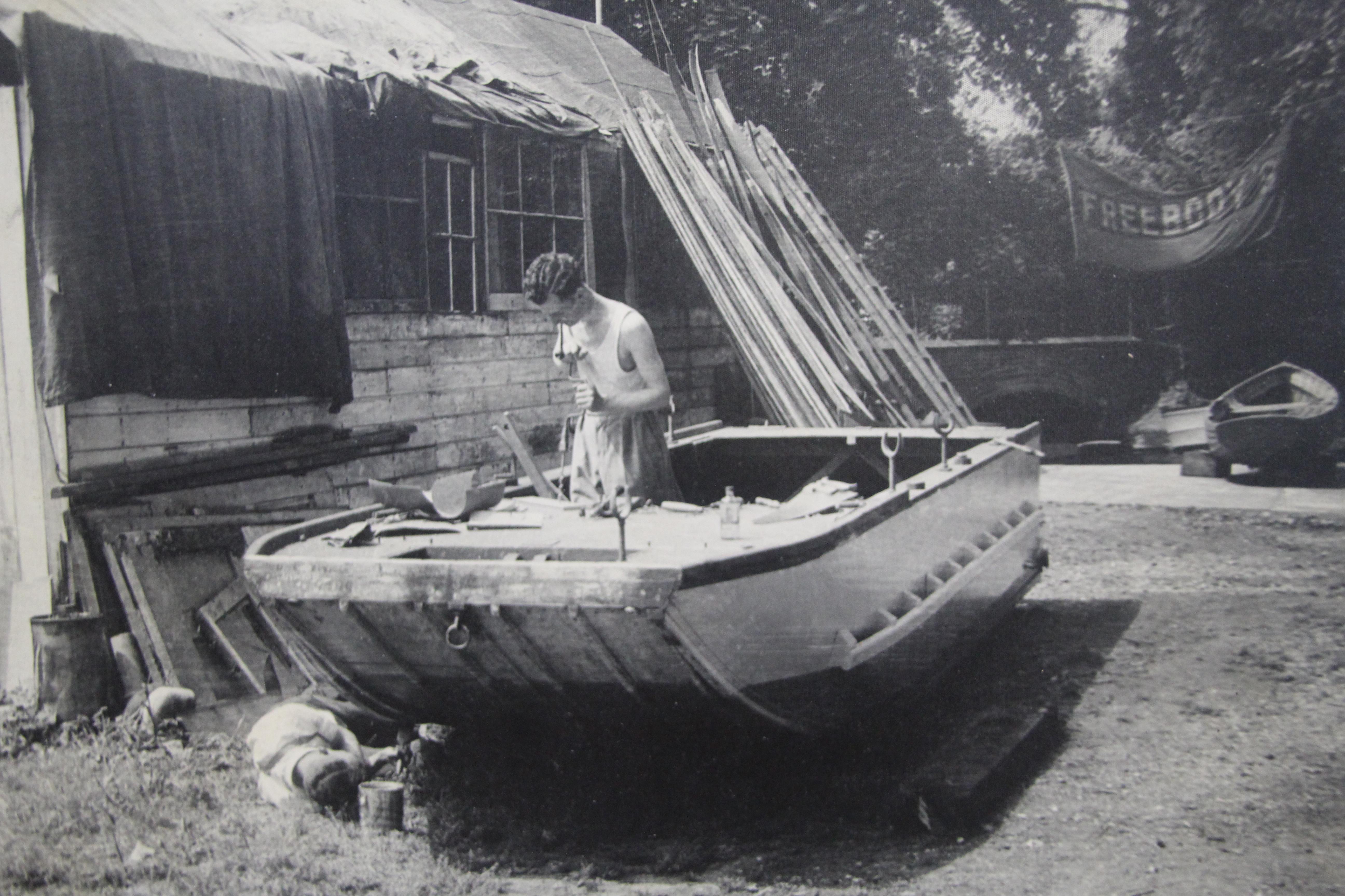 Traditional wooden boats, early photo of Bob Freebody working on large punt at Freebody's boatyard Hurley 