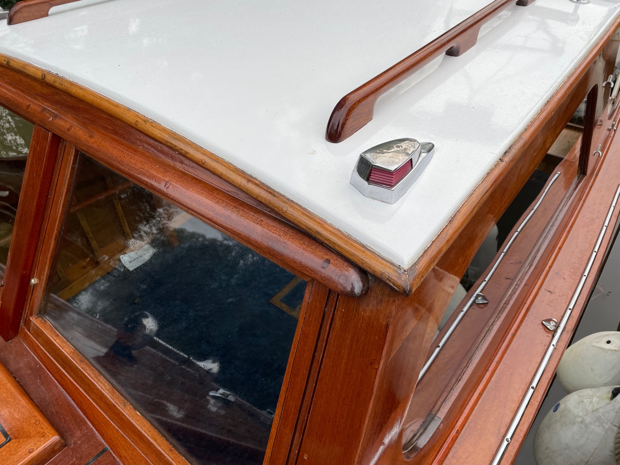 Wooden day boat for sale, detail showing cuddy roof and handrail