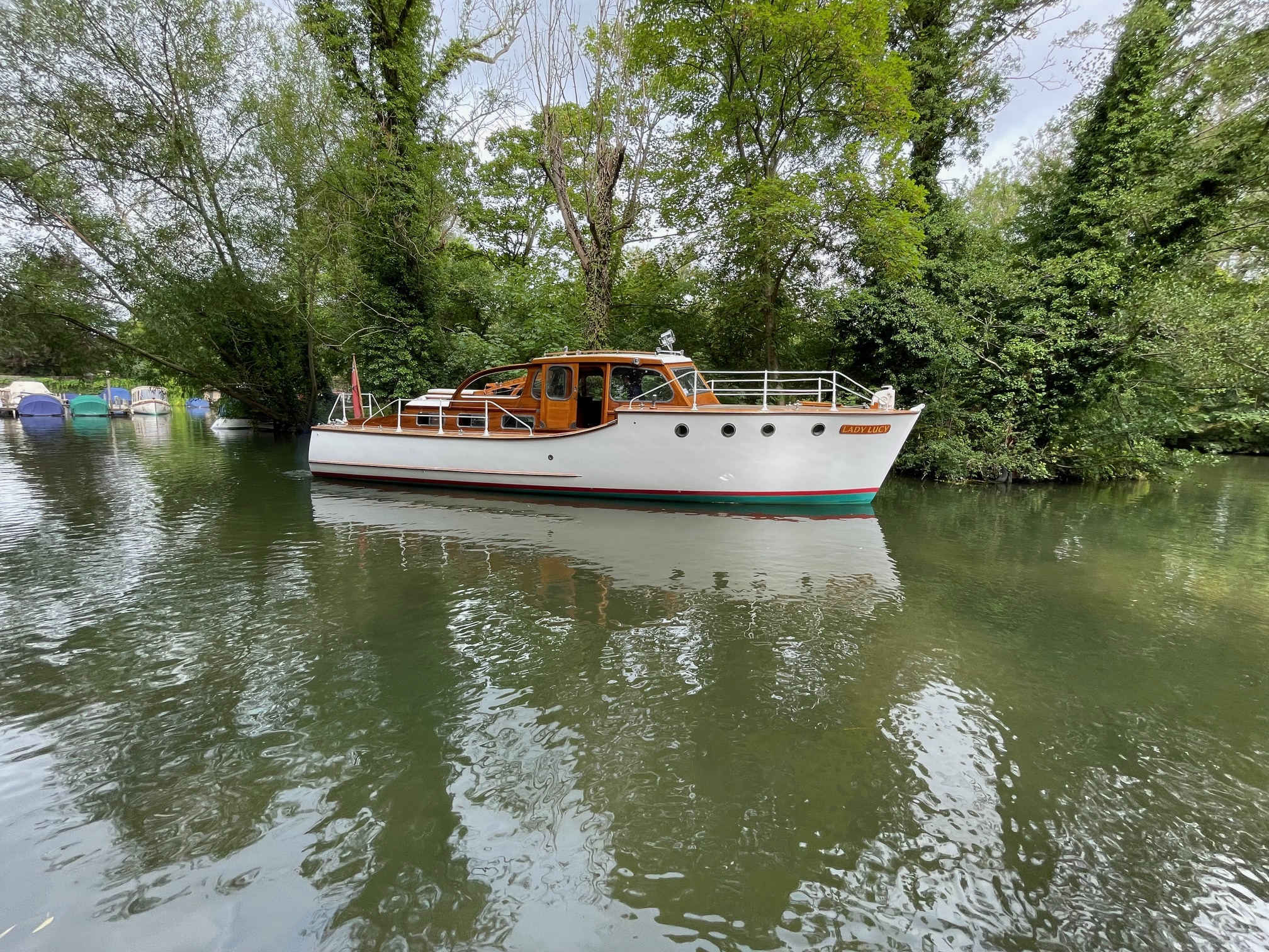 Osborne cruiser for sale, starboard side profile of boat on river Thames
