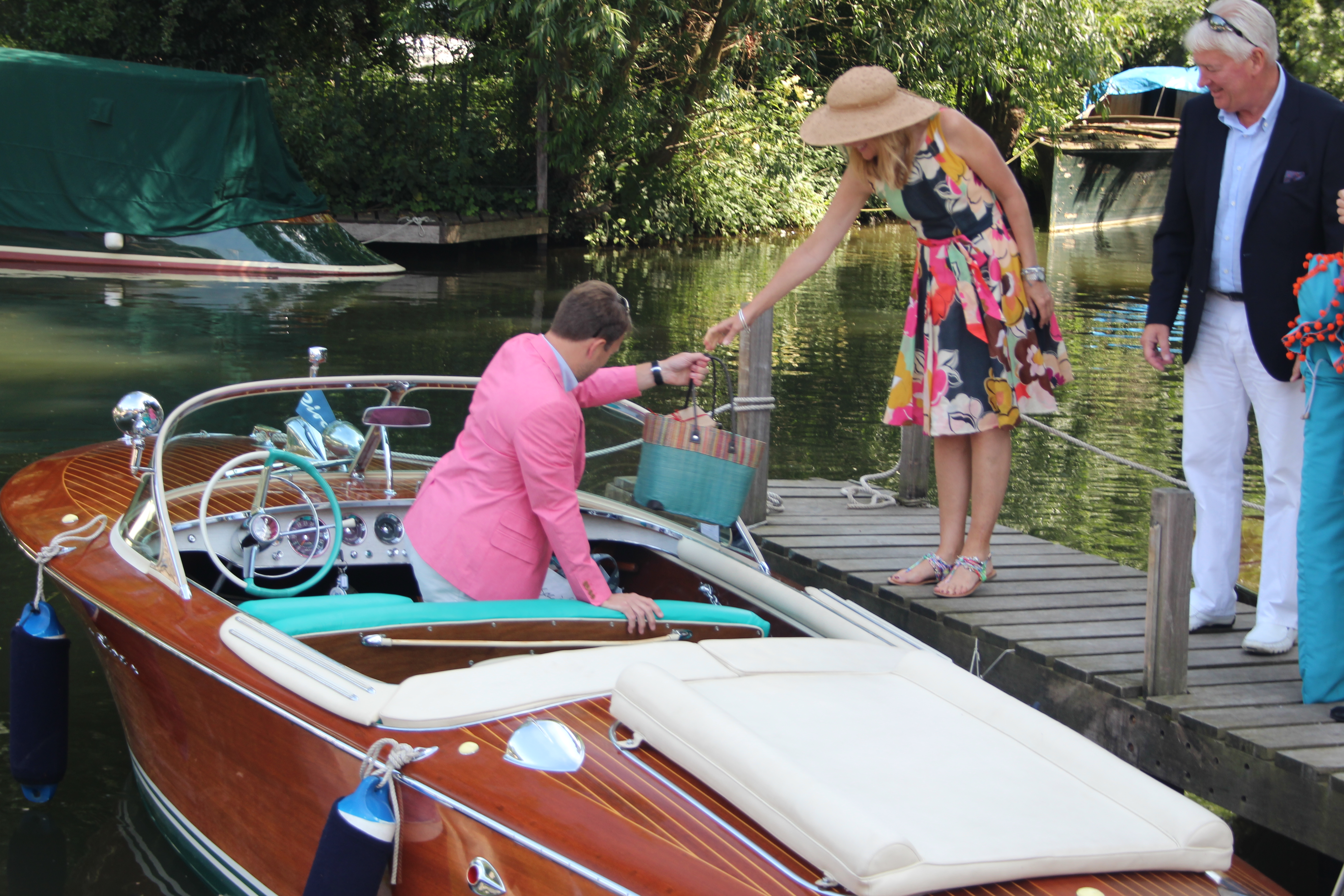 Riva boats for sale, people loading up Riva at the Freebody boatyard mooring ready for a day on the river