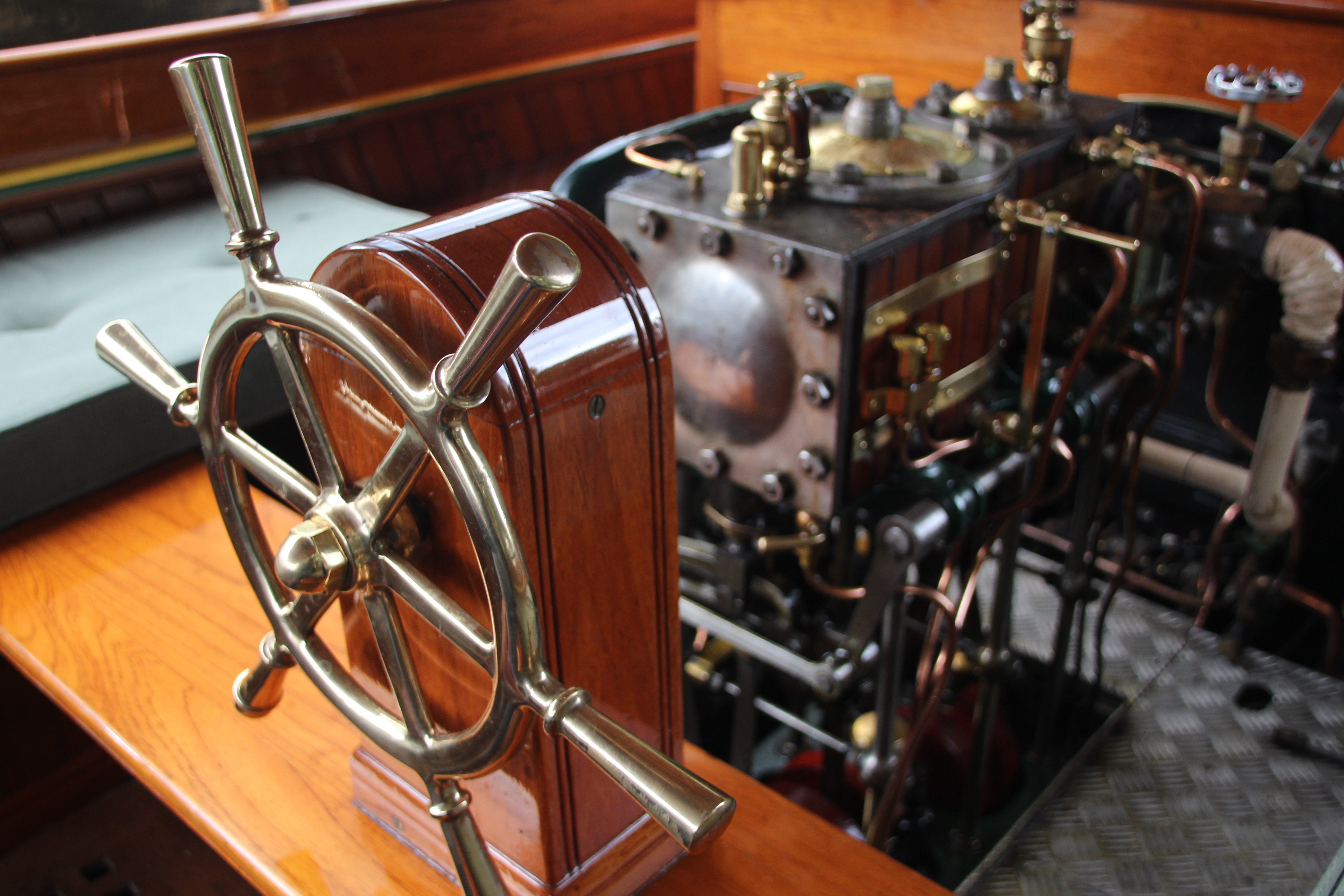 Steam launch for sale, brass steering wheel and Bellis steam engine