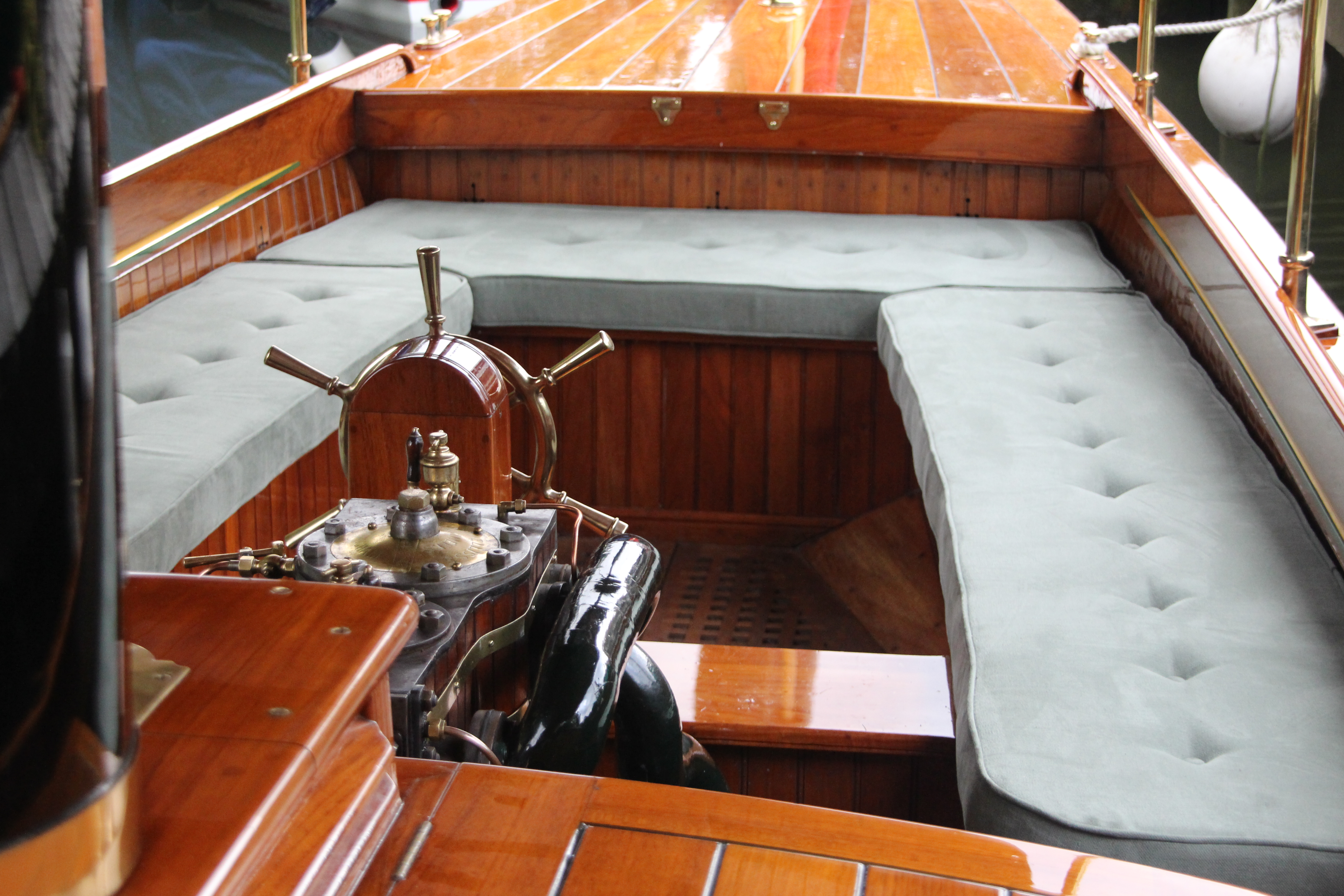 Steam launch for sale, forward cockpit with green upholstery