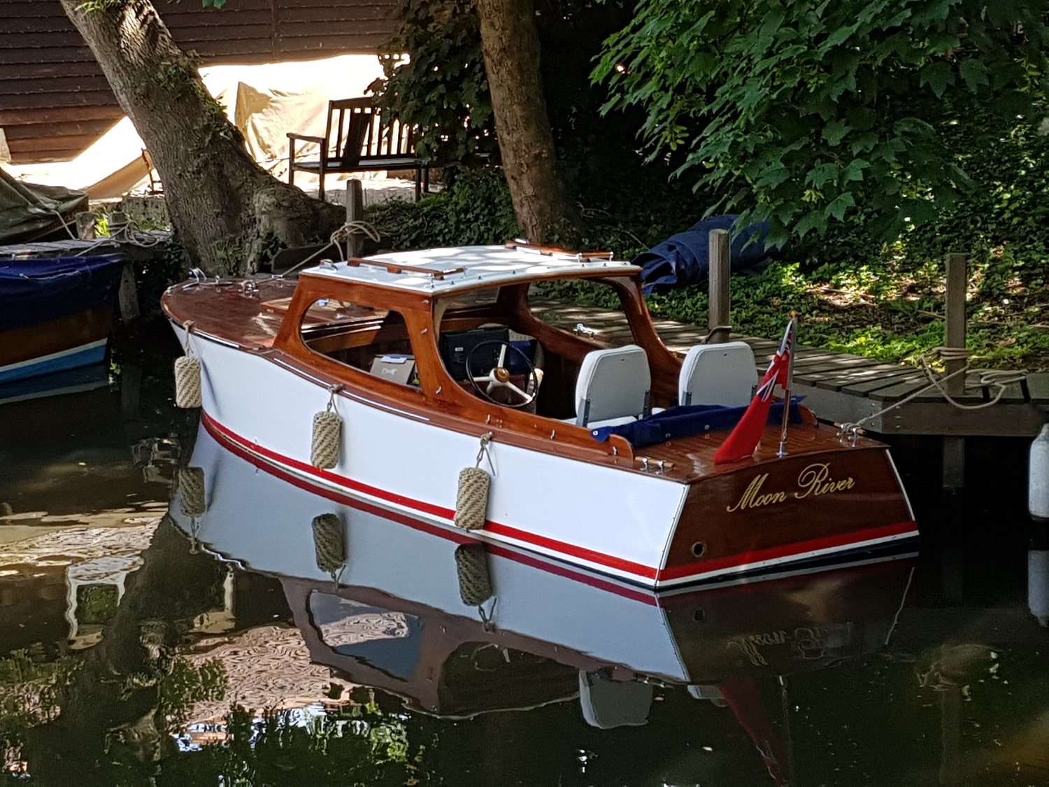 Wooden day boat for sale, moored up at Freebody's boatyard, Hurley