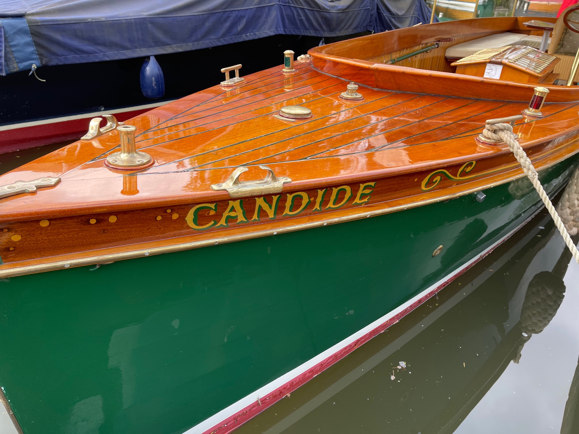 Edwardian beavertail launch for sale, detail of green painted hull side, forward deck and name