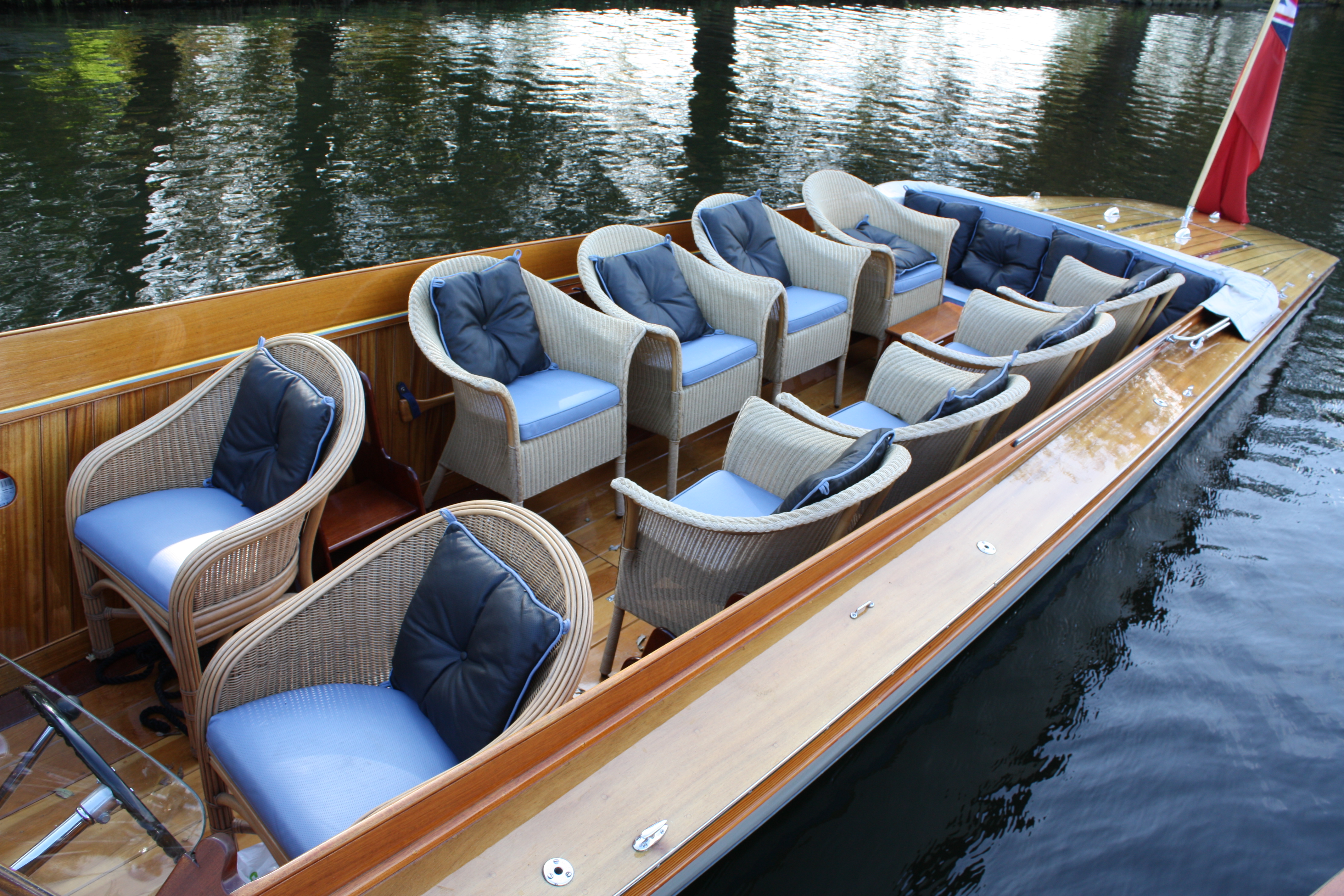 Slipper launch for sale, cockpit showing seating for 12 with Lloyd Looms chairs