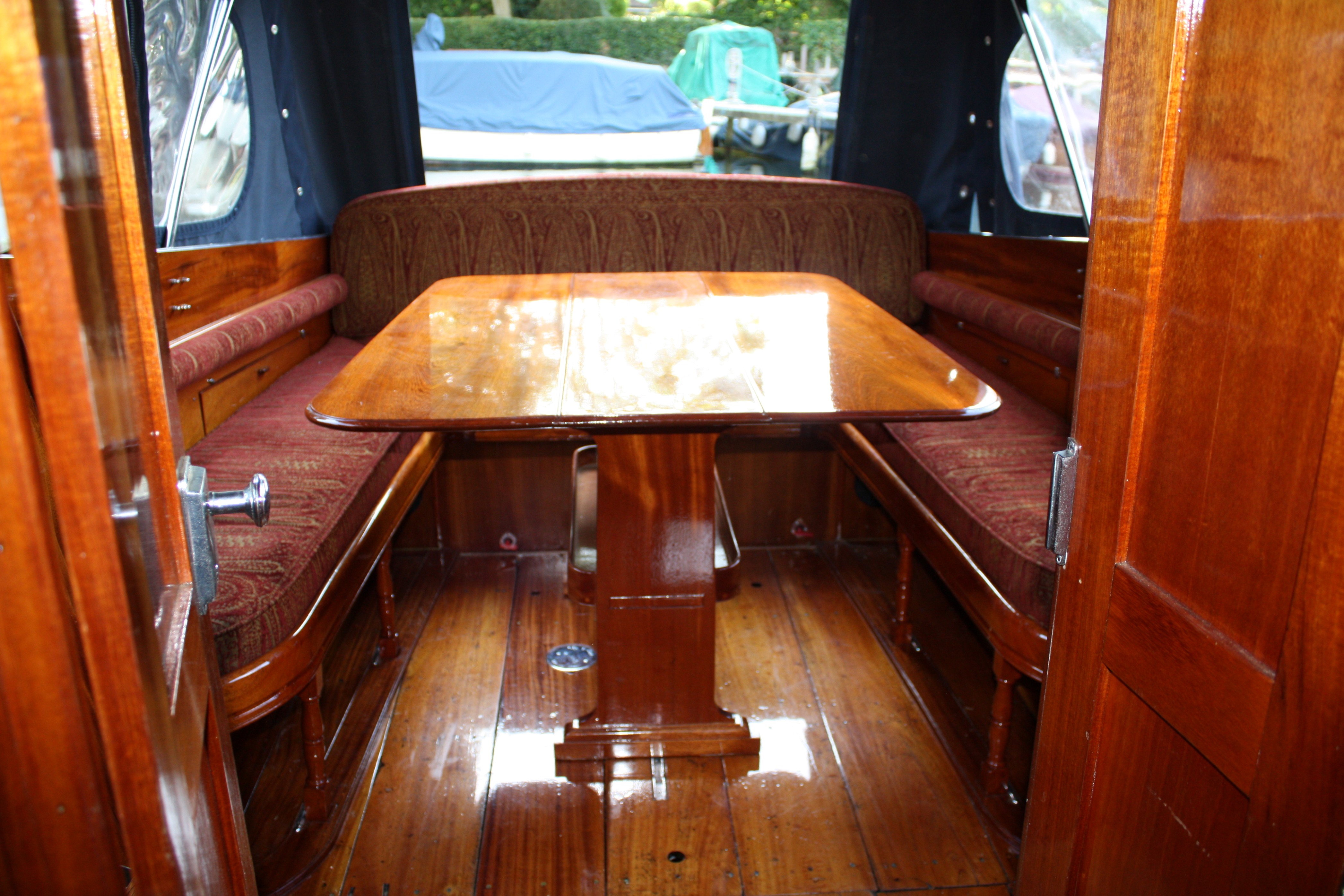 Cabin cruiser for sale, view from cabin looking aft into cockpit with table