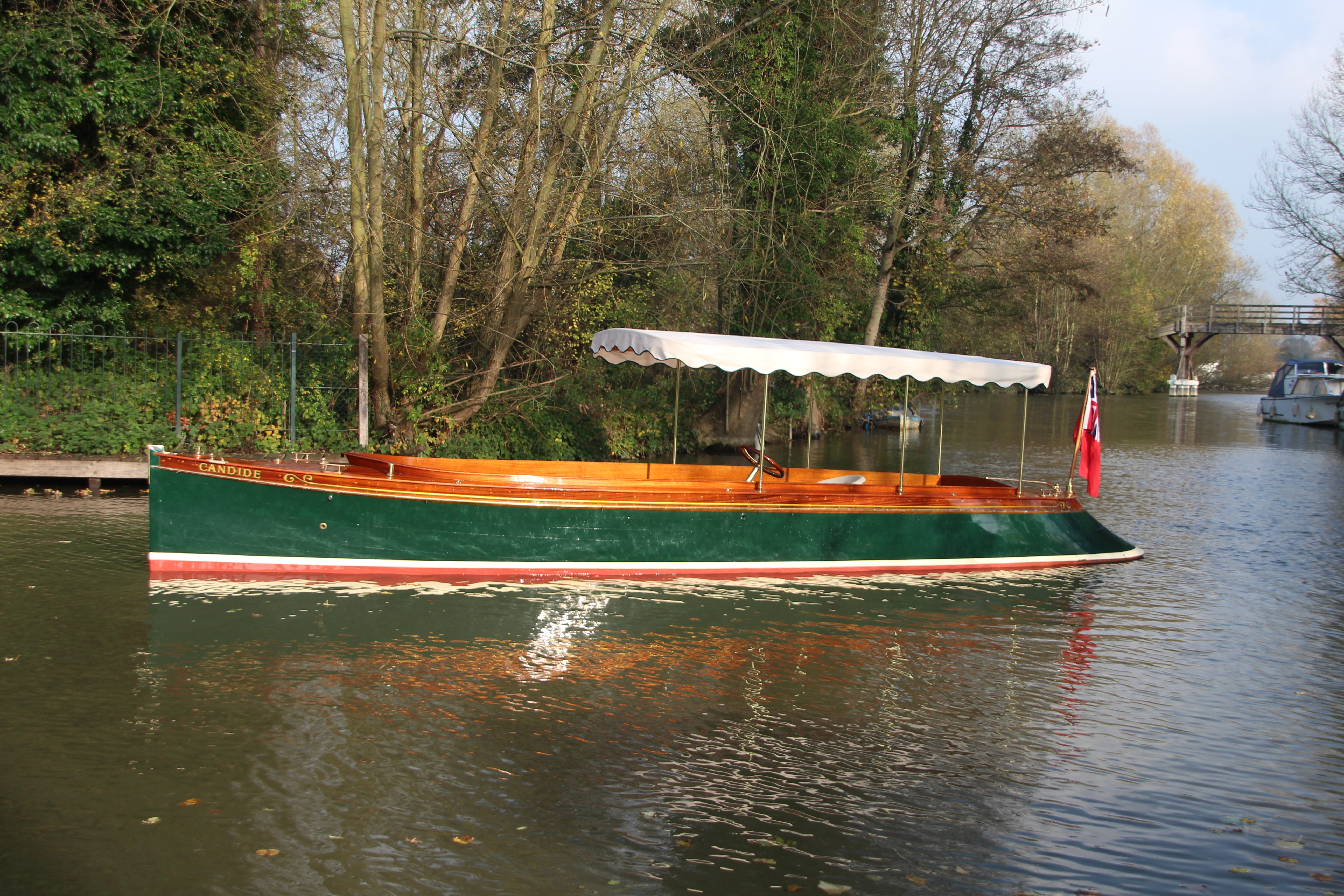Edwardian beavertail launch for sale, side profile on river