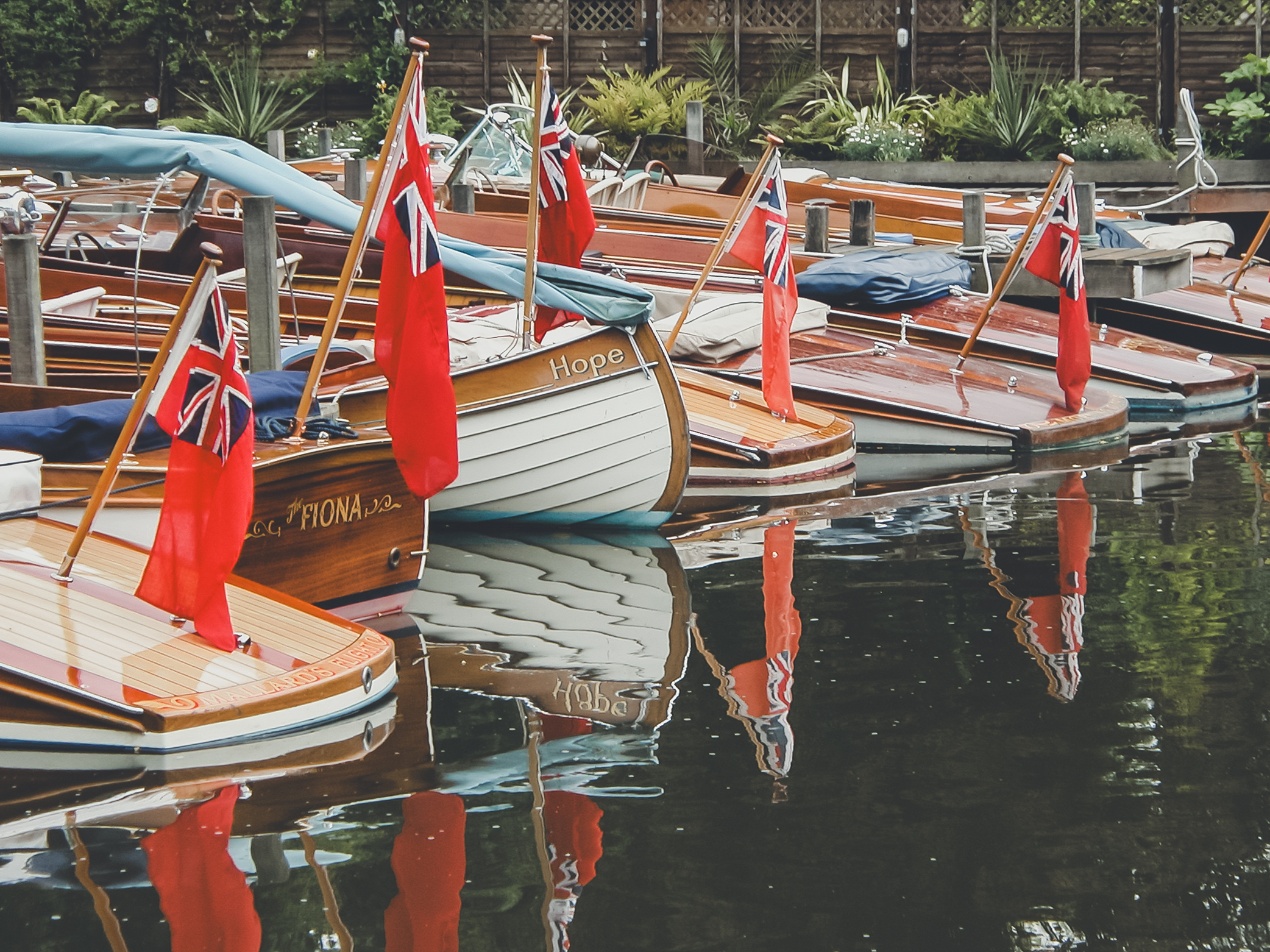 Peter Freebody & Co, boats and flags on moorings at Peter Freebody & Co
