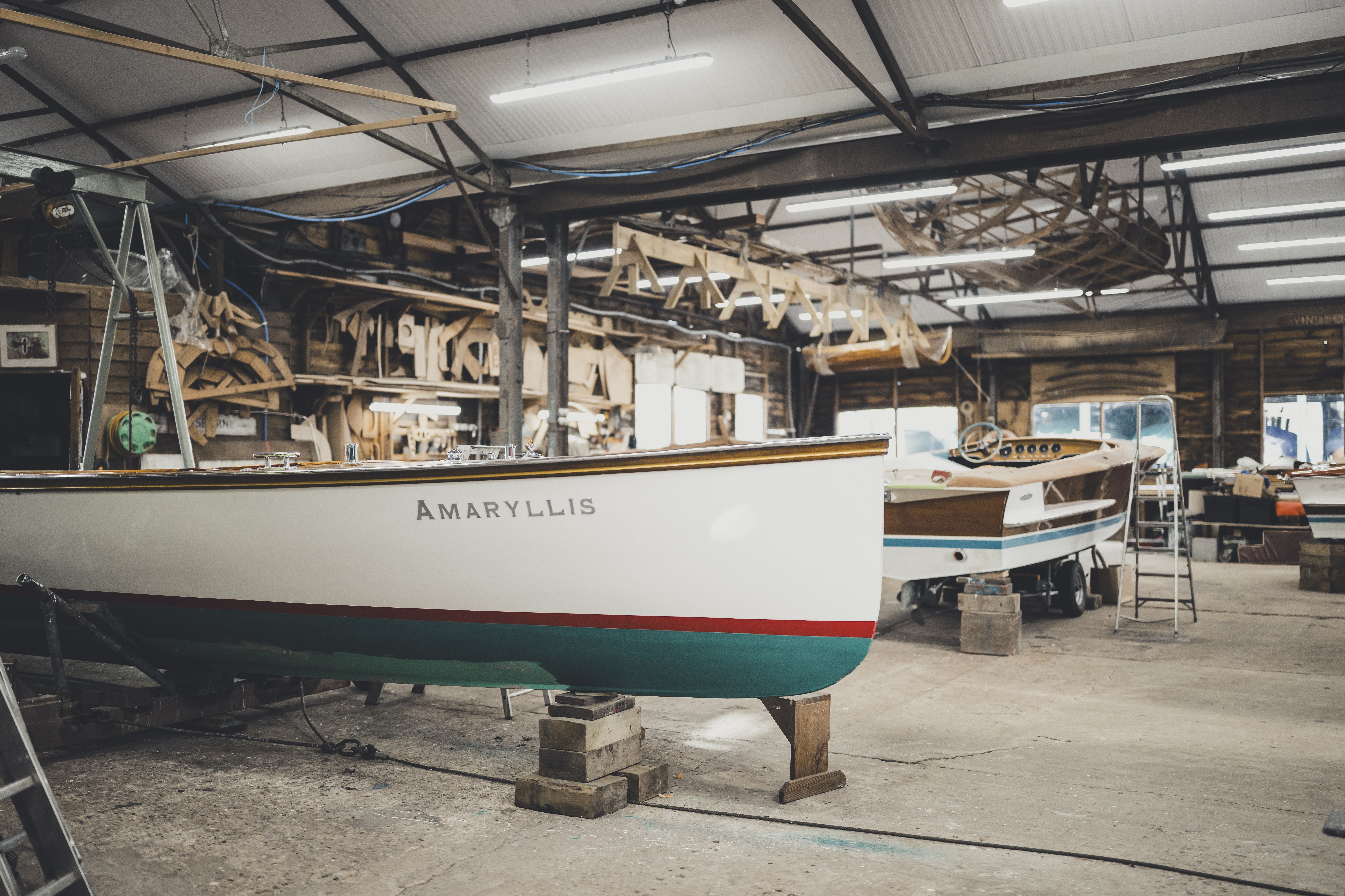 Wooden boat restoration, 50ft umpire launch undergoing restoration in the workshop at Peter Freebody & Co