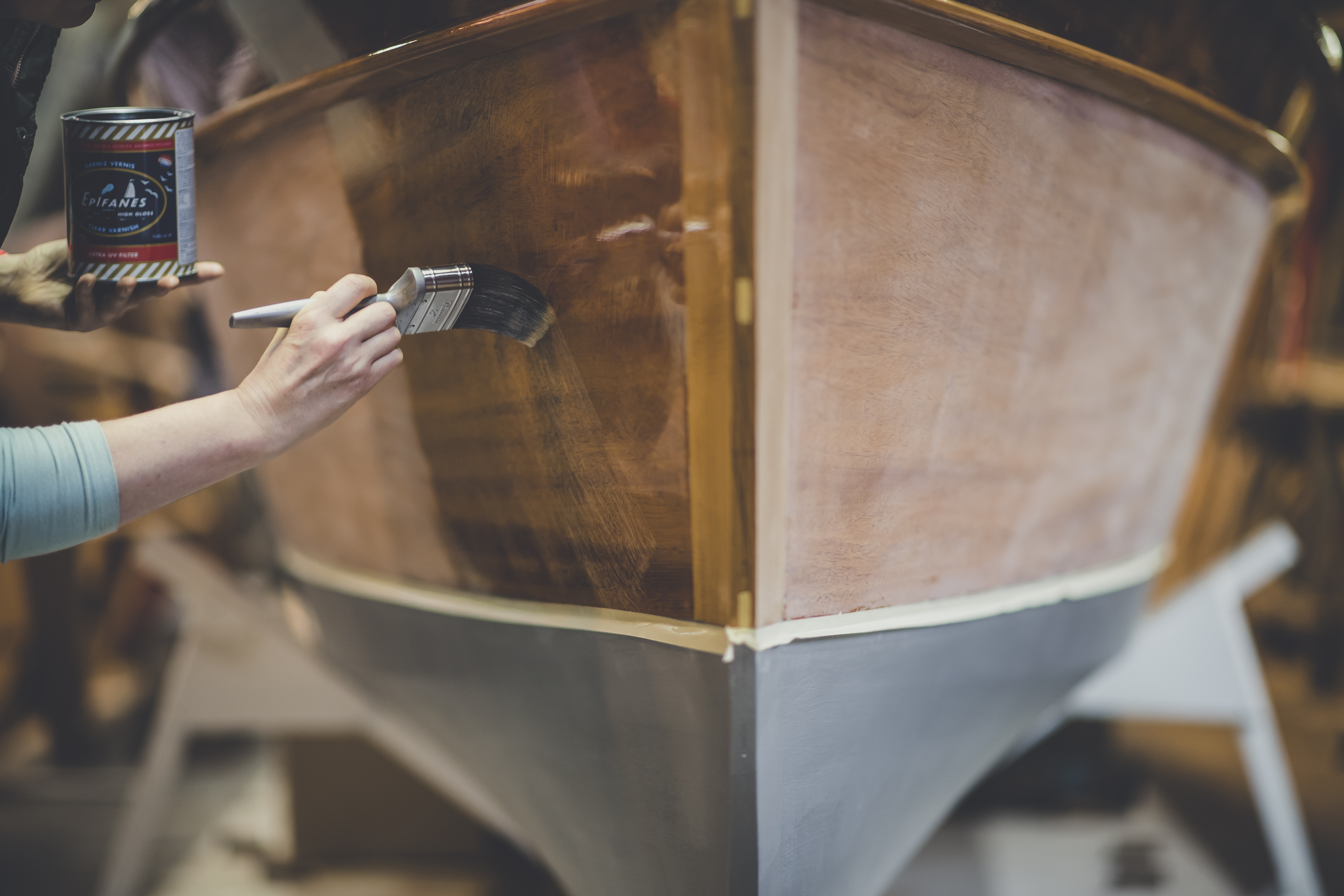 Wooden boat restoration, varnishing works to slipper launch in Freebody workshop