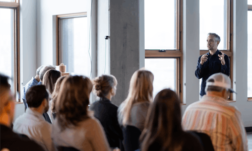 Mowgli Holmes speaking to Phylos employees