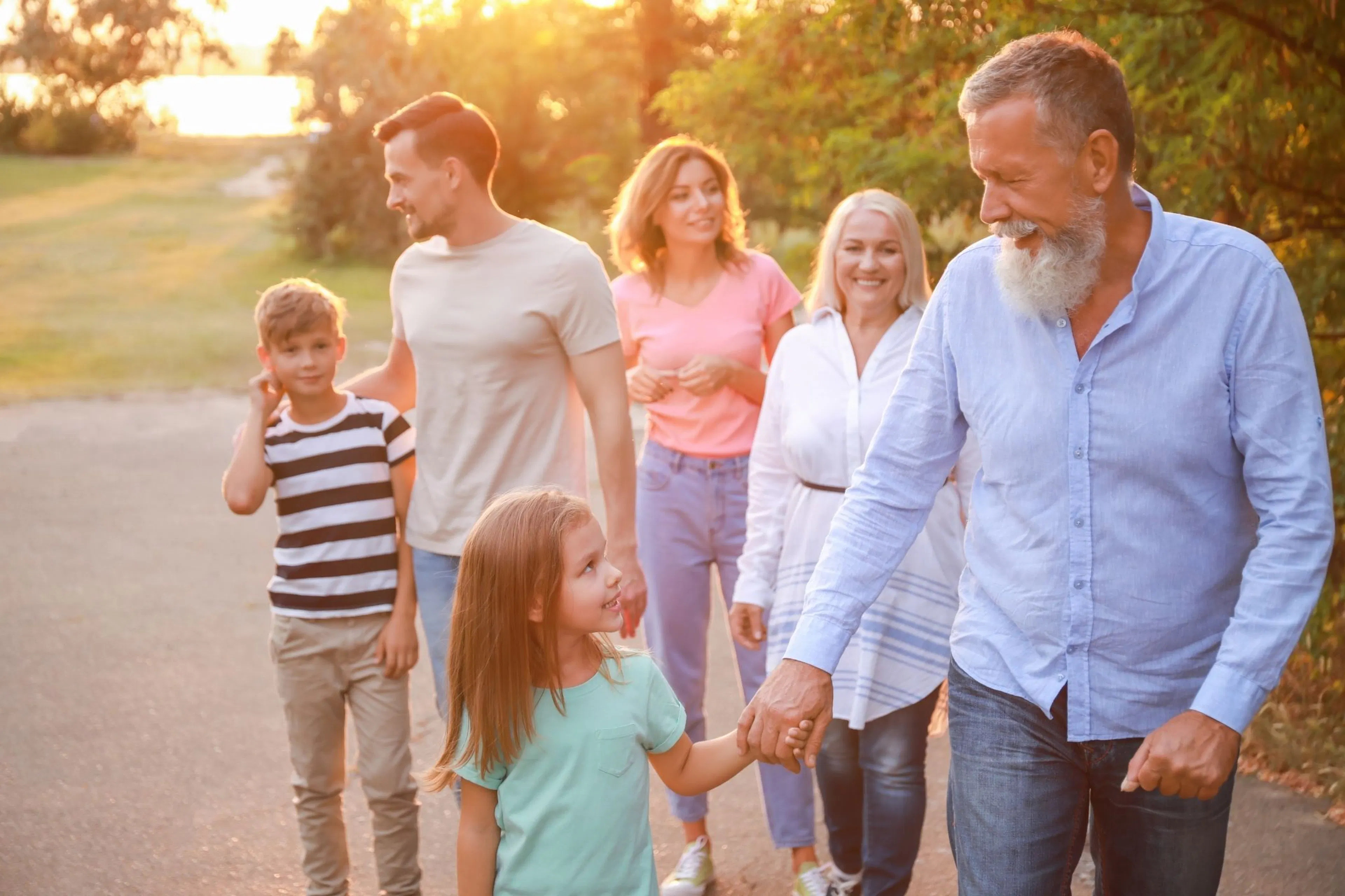 family walking in the sunshine