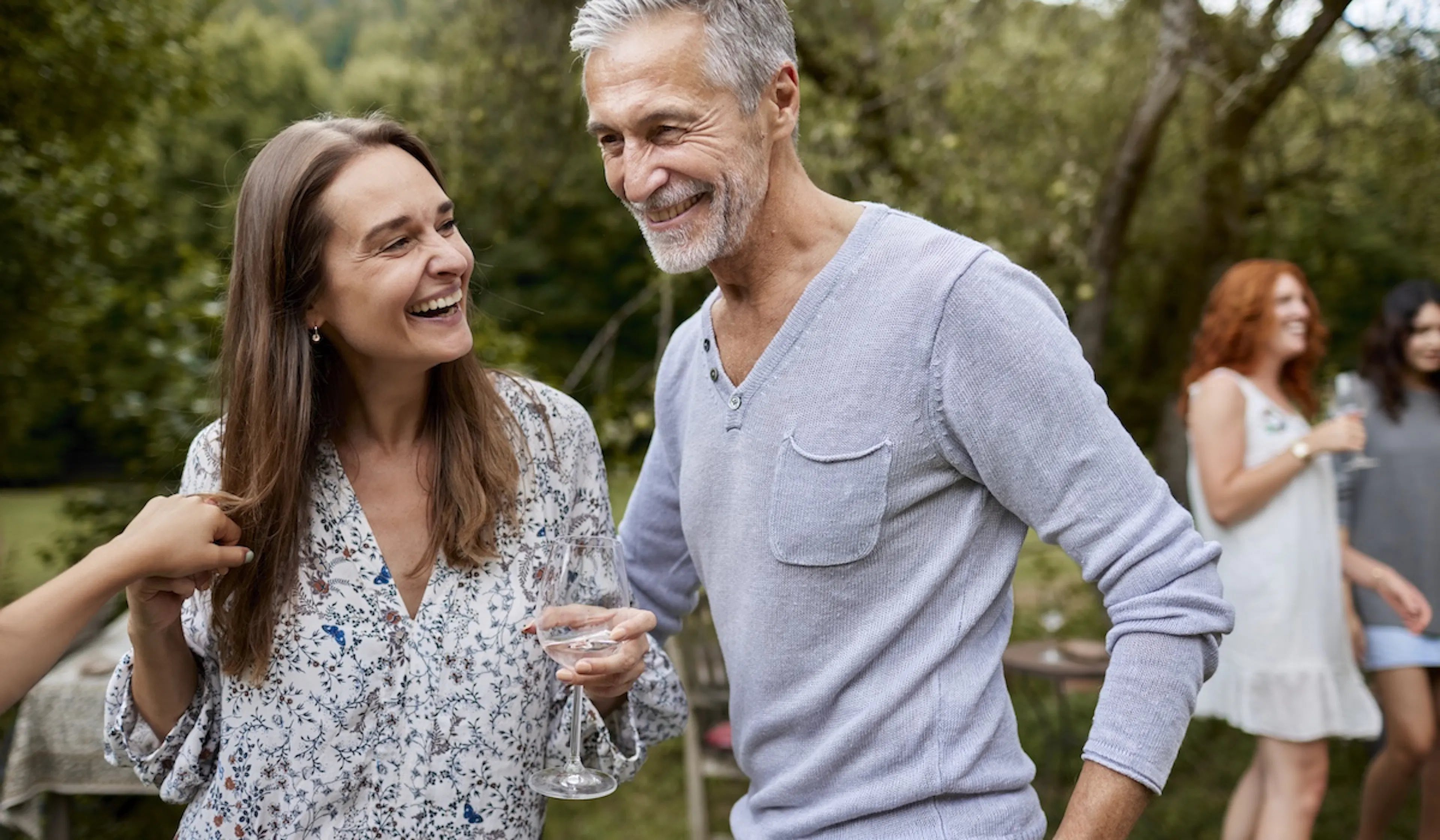 Happy man and woman having an outdoor celebration