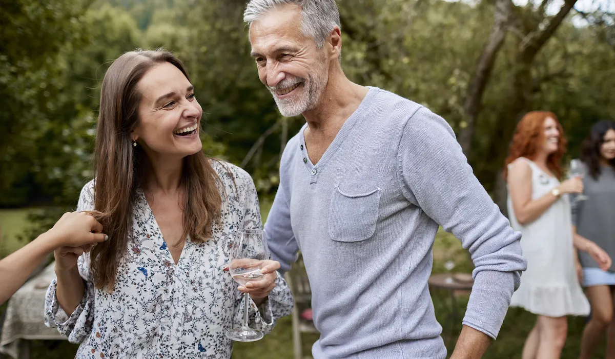 Happy man and woman having an outdoor celebration