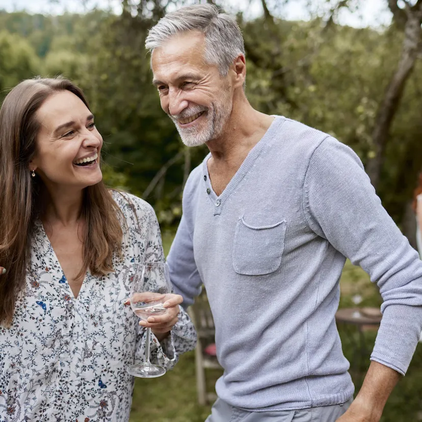 Happy man and woman having an outdoor celebration