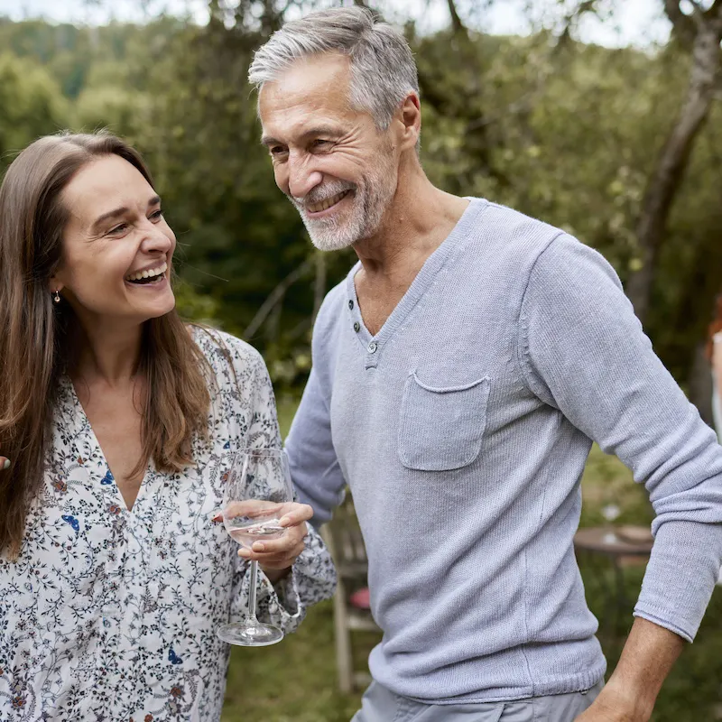 Happy man and woman having an outdoor celebration