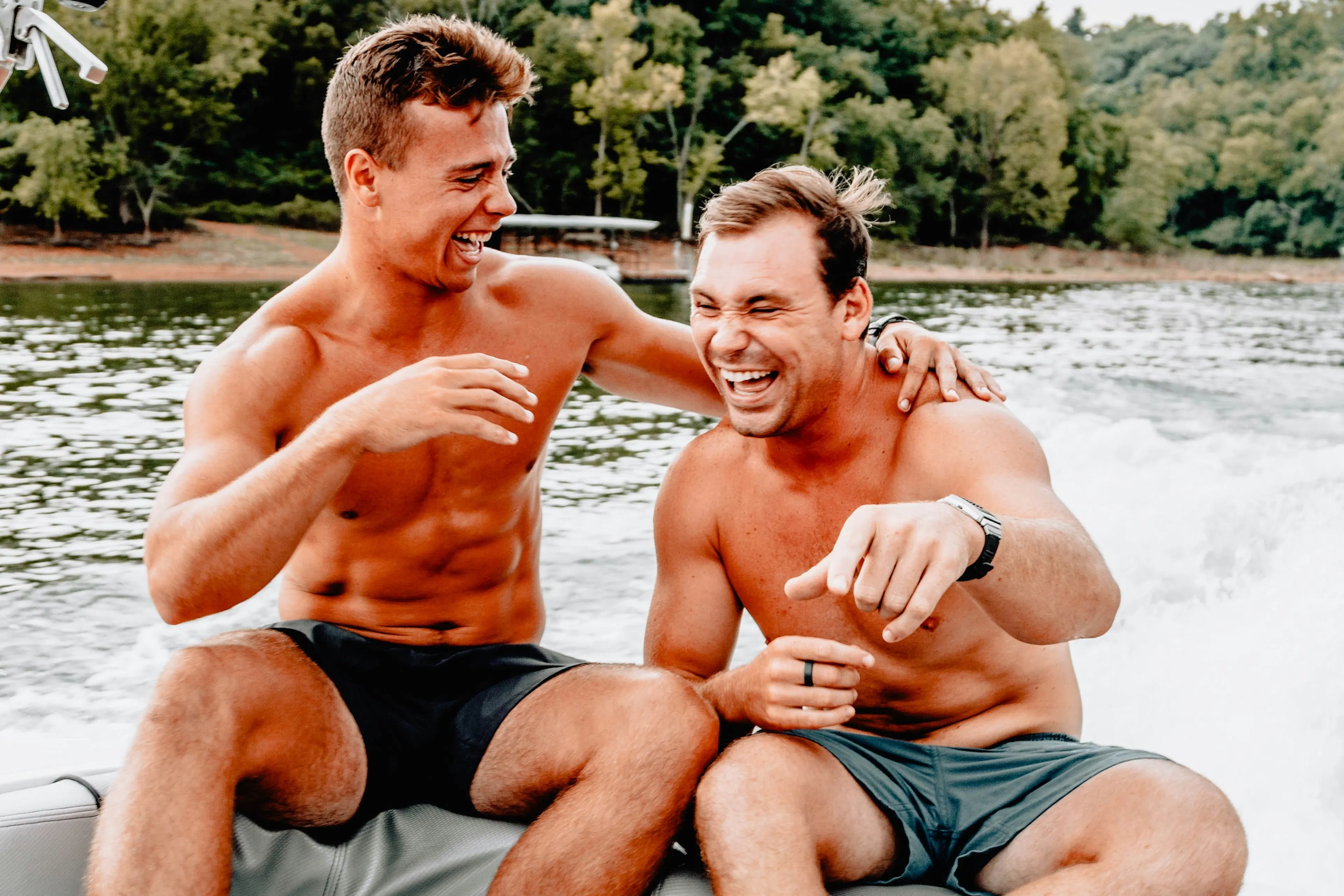 friends laughing on a boat